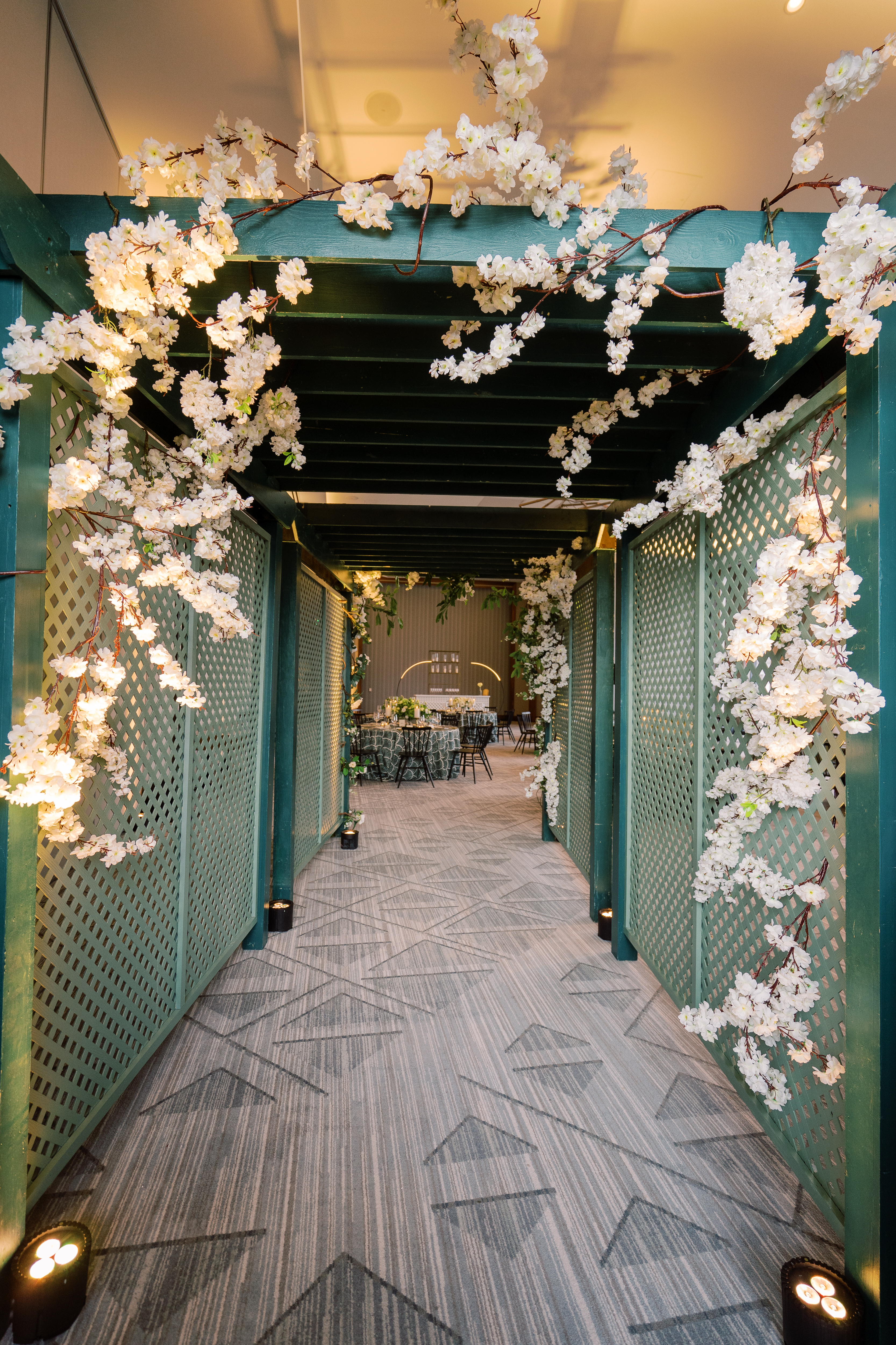 White floral decor over ball room entry way. 