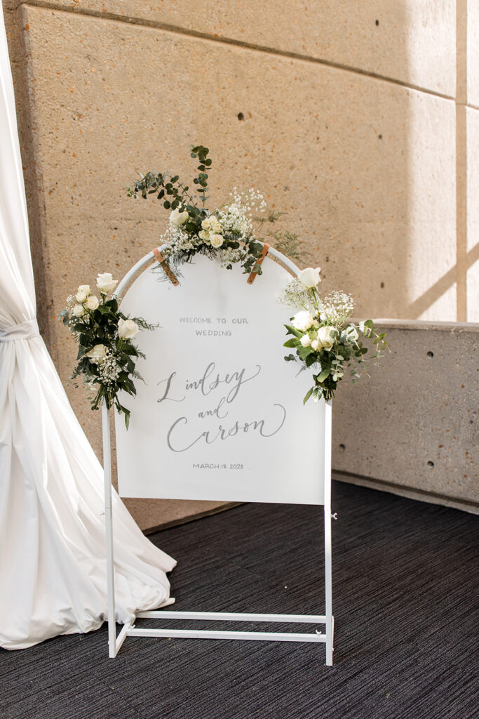 Arched wedding welcome sign.