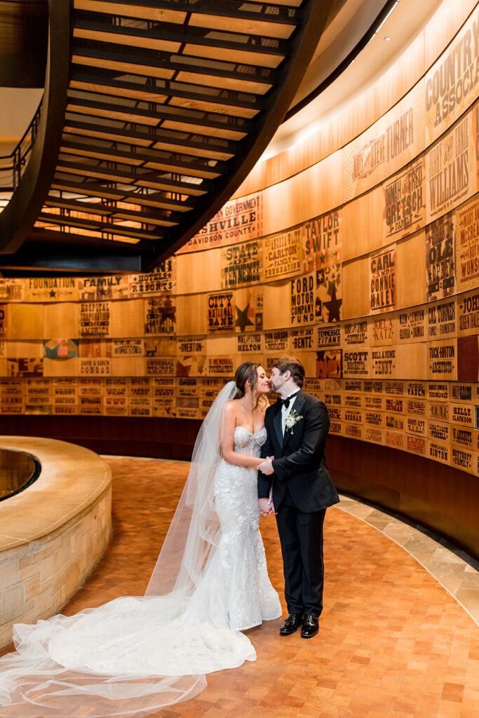 Bride and Groom share a kiss inside Country Music Hall of Fame and Museum.