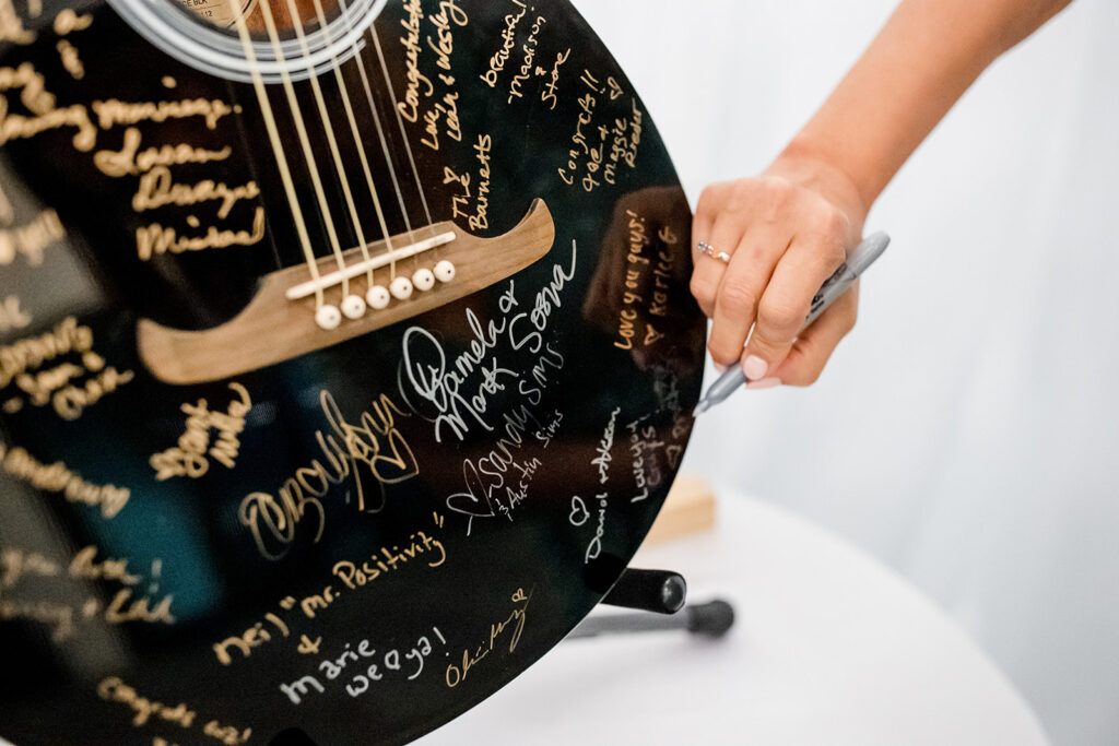 Guest signed guitar on sign-in table. 