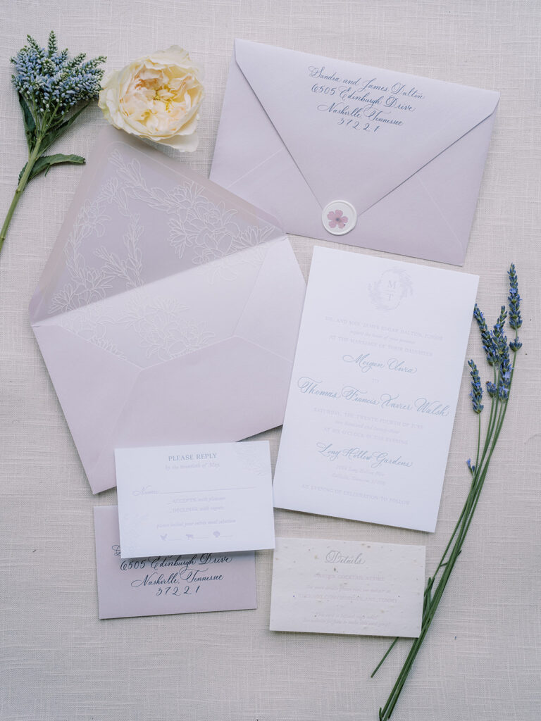 Invitation suite of envelope, invite, vellum wrap, rsvp and details cards.