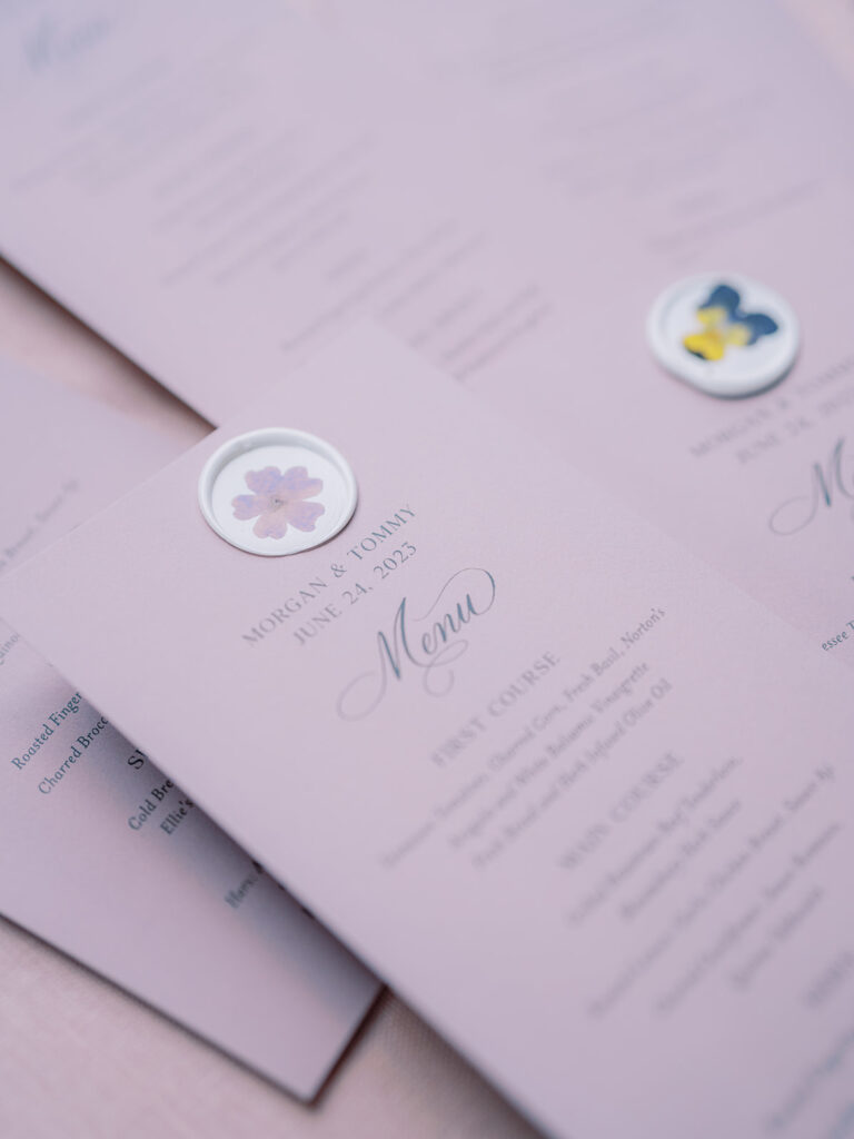 Reception Menus in lavender topped with wax seals.