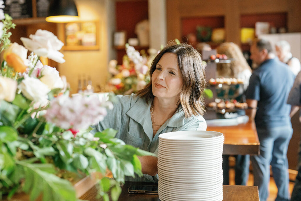 Party Planner arranging florals on table