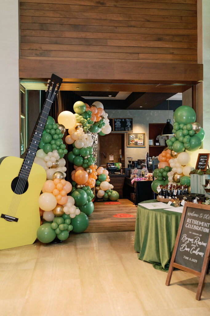 Party room displaying balloon decor and signage