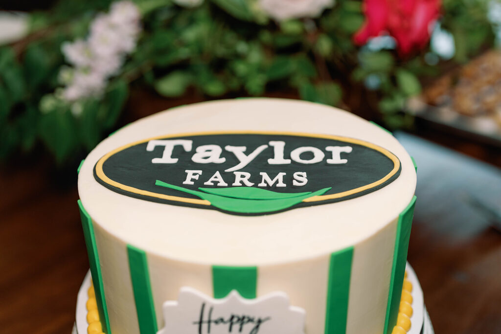 Cake decorated with "Taylor Farms, Happy Retirement"