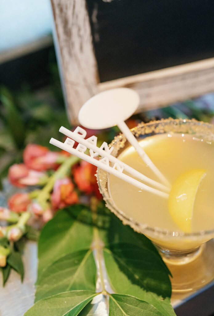 Custom laser cut drink stirs in cocktail glass