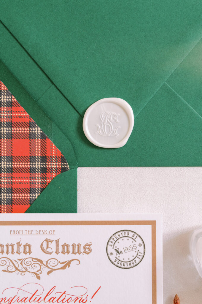 Plaid-lined green envelope with wax seal displaying a Letter from Santa.