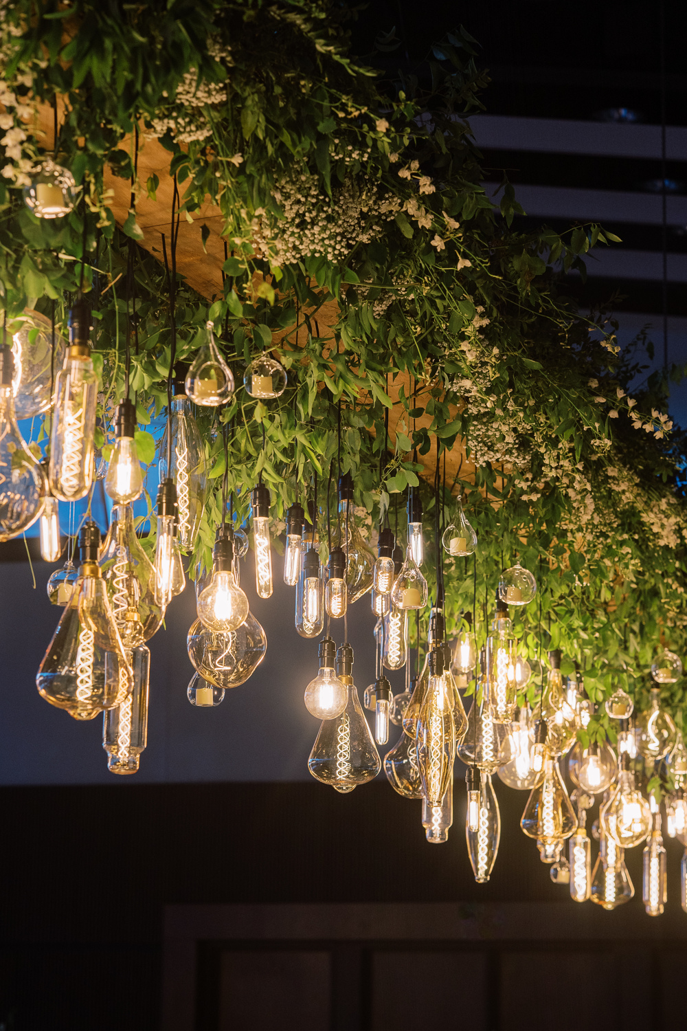 Custom Nashville Wedding Details and Hanging floral chandelier styled with vintage lighting.