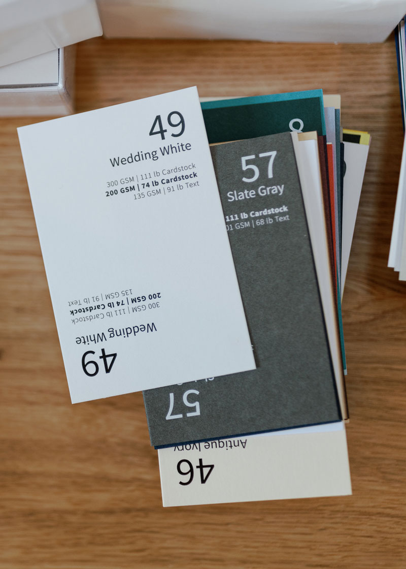 Paper samples for custom stationery and wedding invitation consultations and design