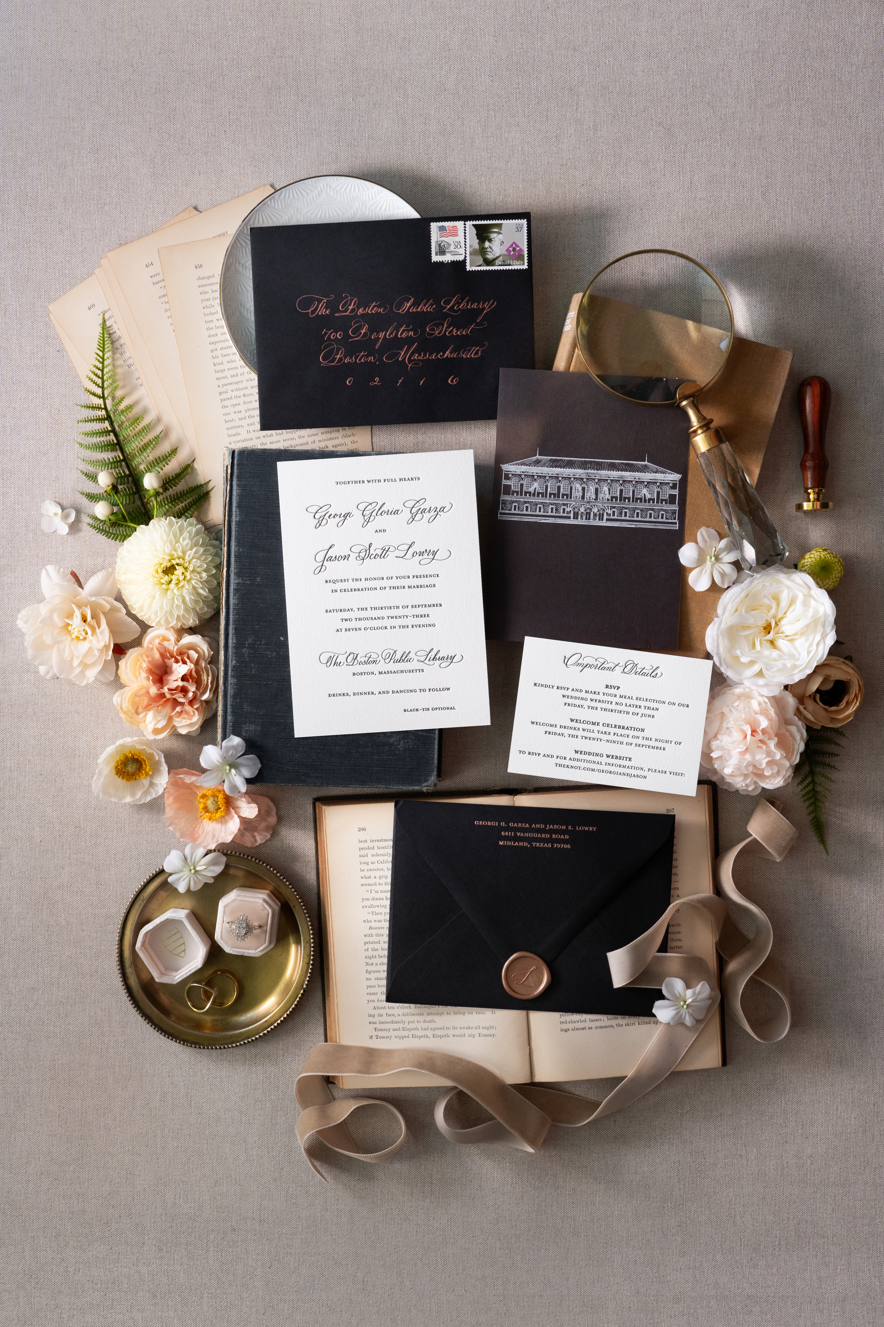 Styled flat lay of formal wedding invitation suite
