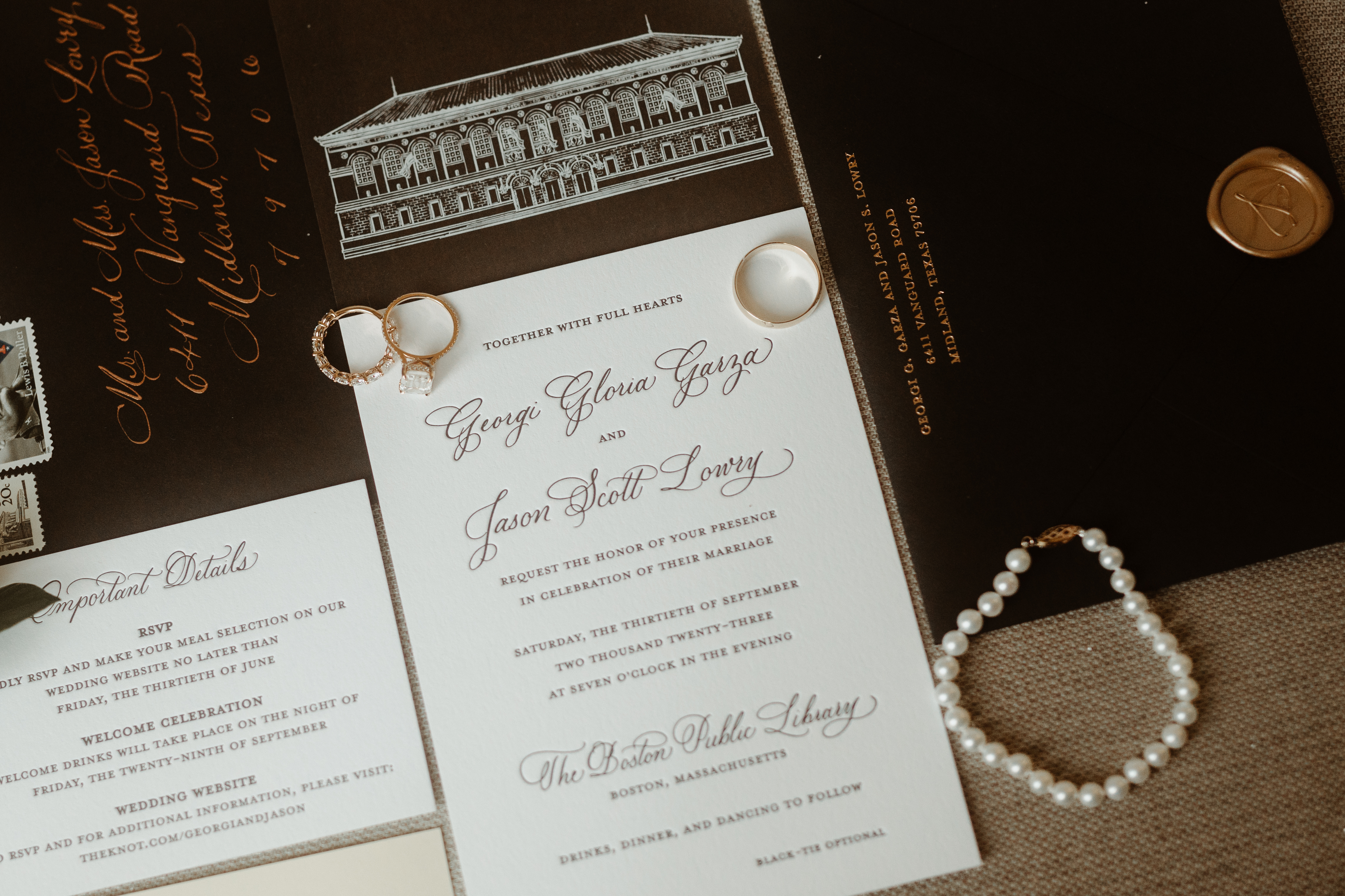 Wedding invitation suite styled with jewelry