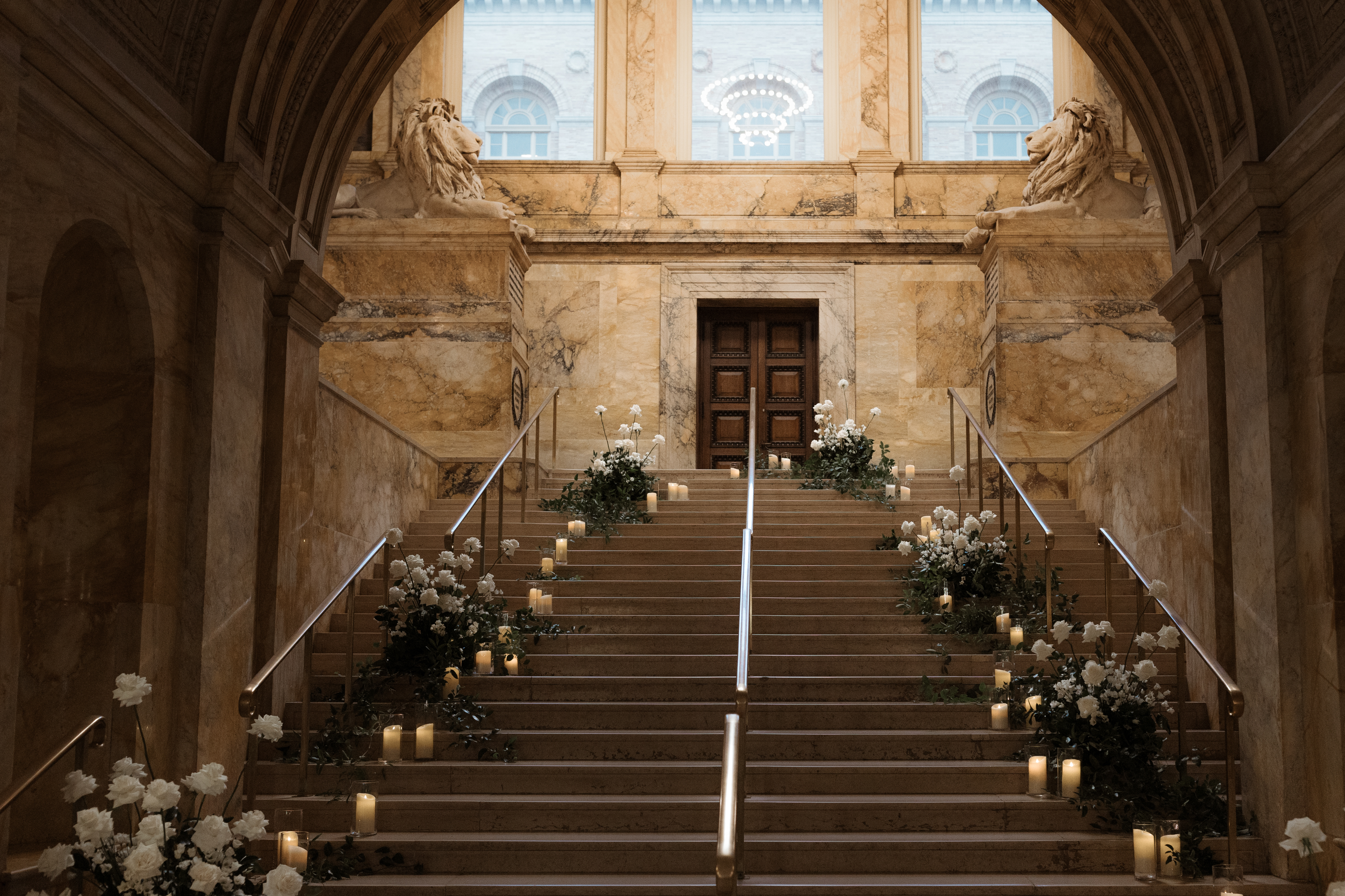 entrance stairway of Boston Public Library styled with florals