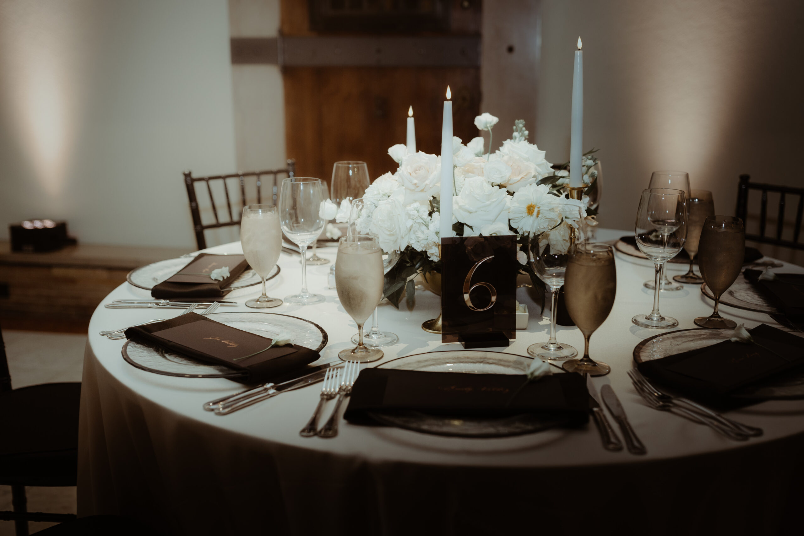 custom table number among florals and formal tablescape