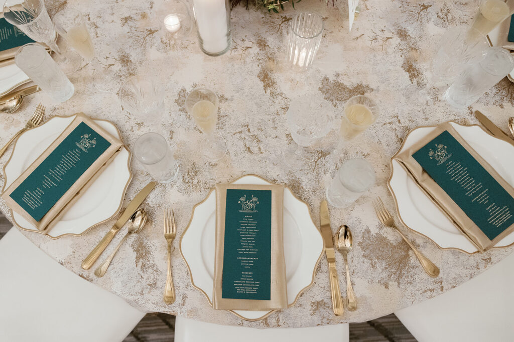 formally styled dining table with custom menus atop plates. 