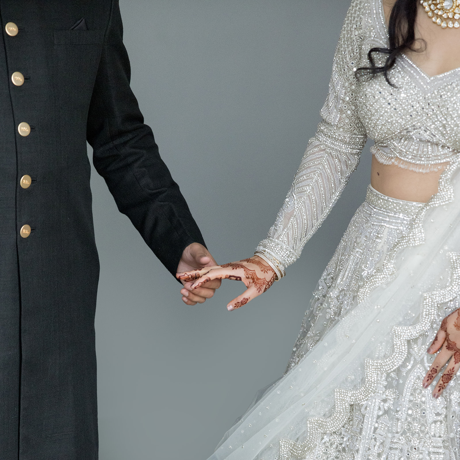 Bride and Groom side by side holding hands