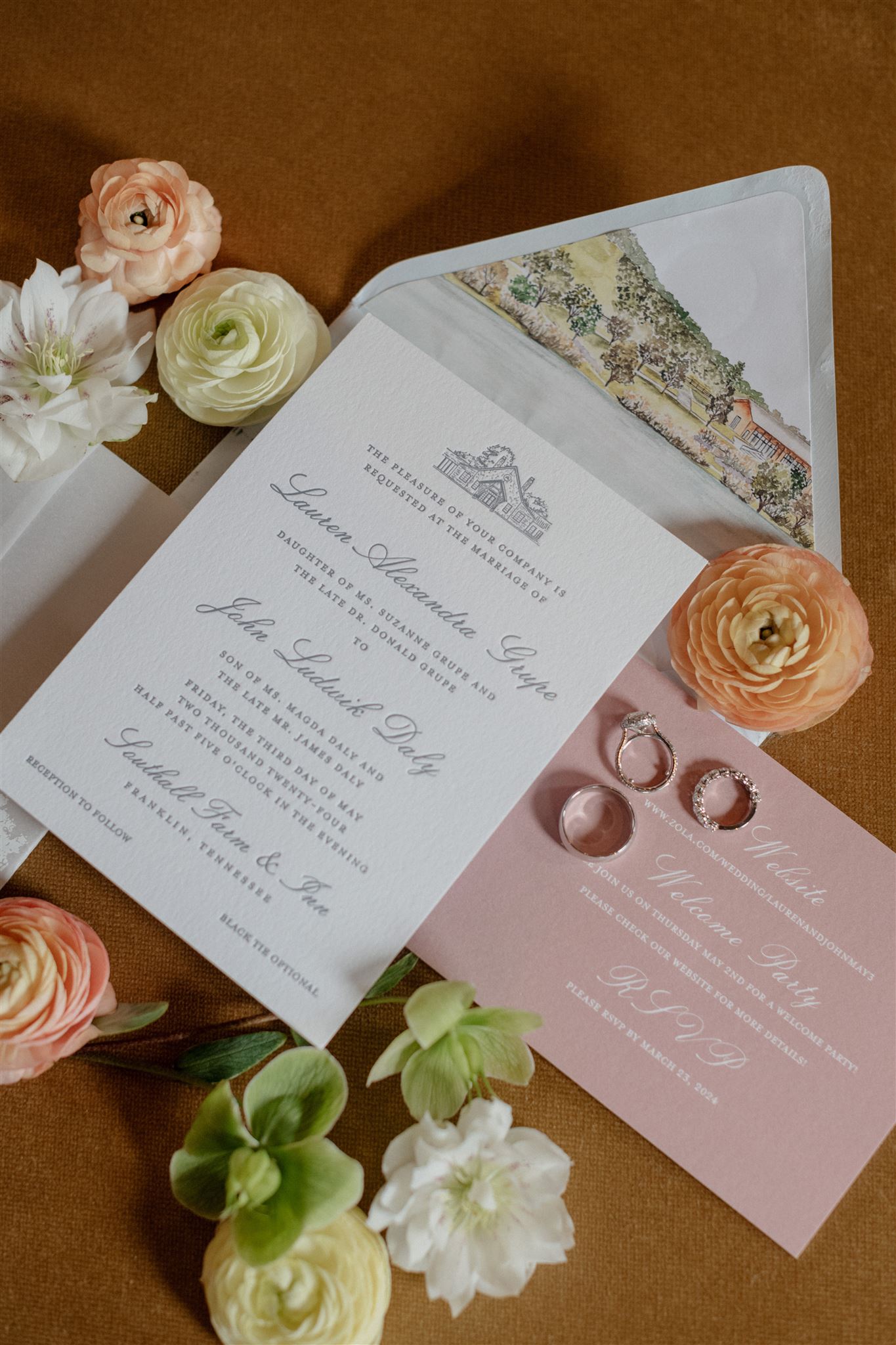 Custom Spring Wedding Details | Flat lay of formal wedding invitation suite decorated with flowers.