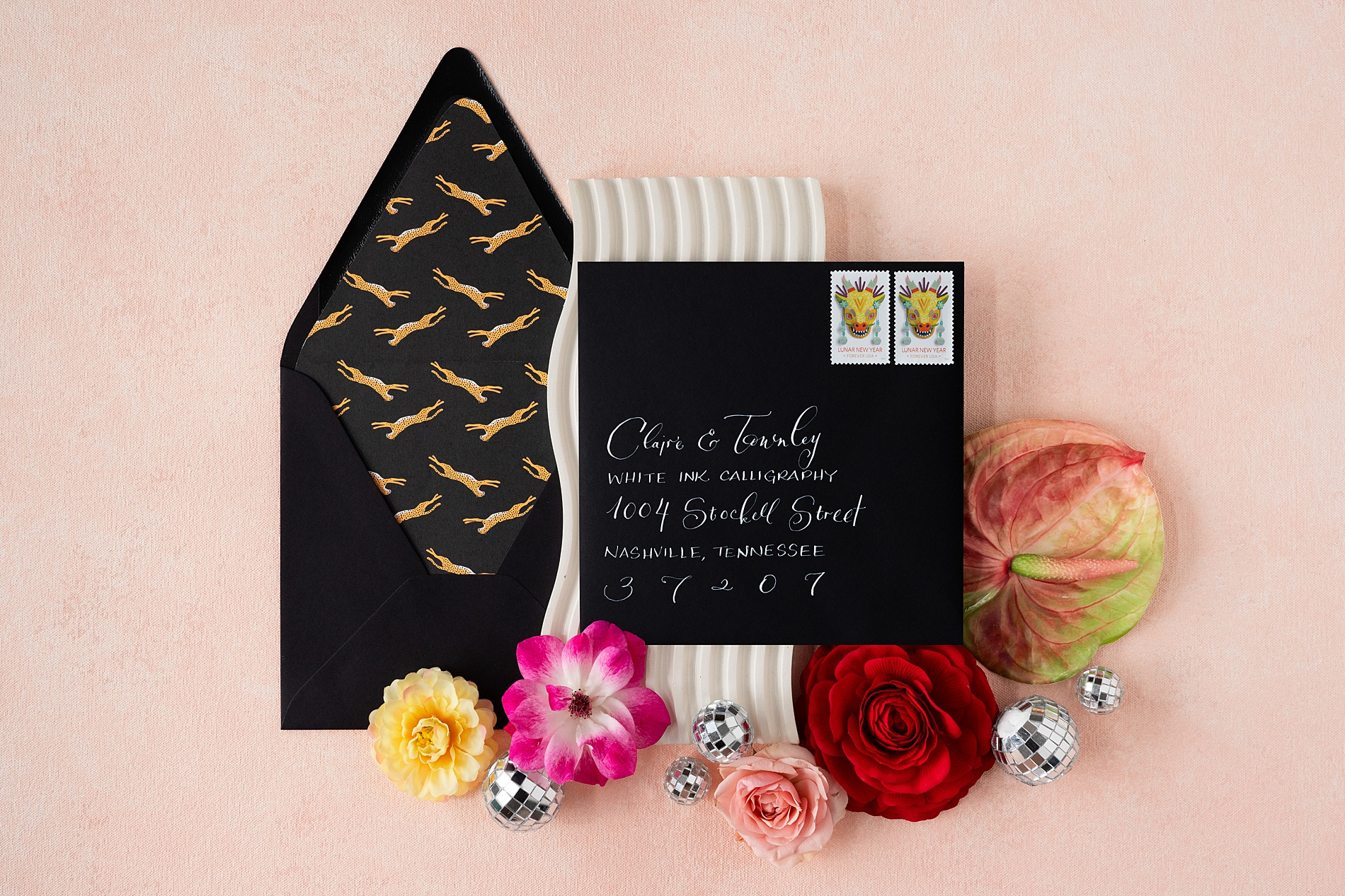 Custom Bold + Playful Spring Fling Invitation Suite with a black envelope and custom leopard envelope liner