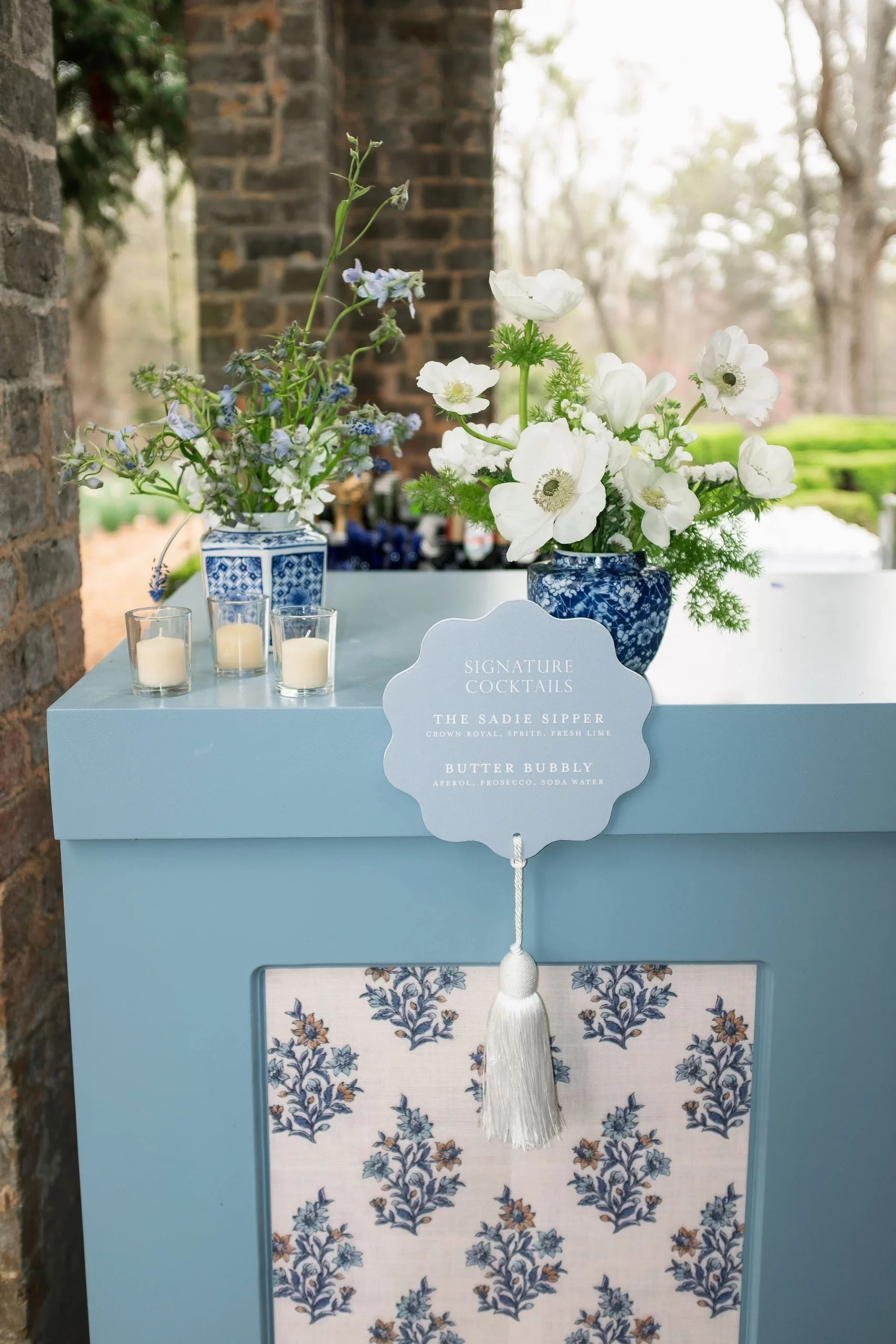 custom blue bar signs attached to bar with fun white tassel. 