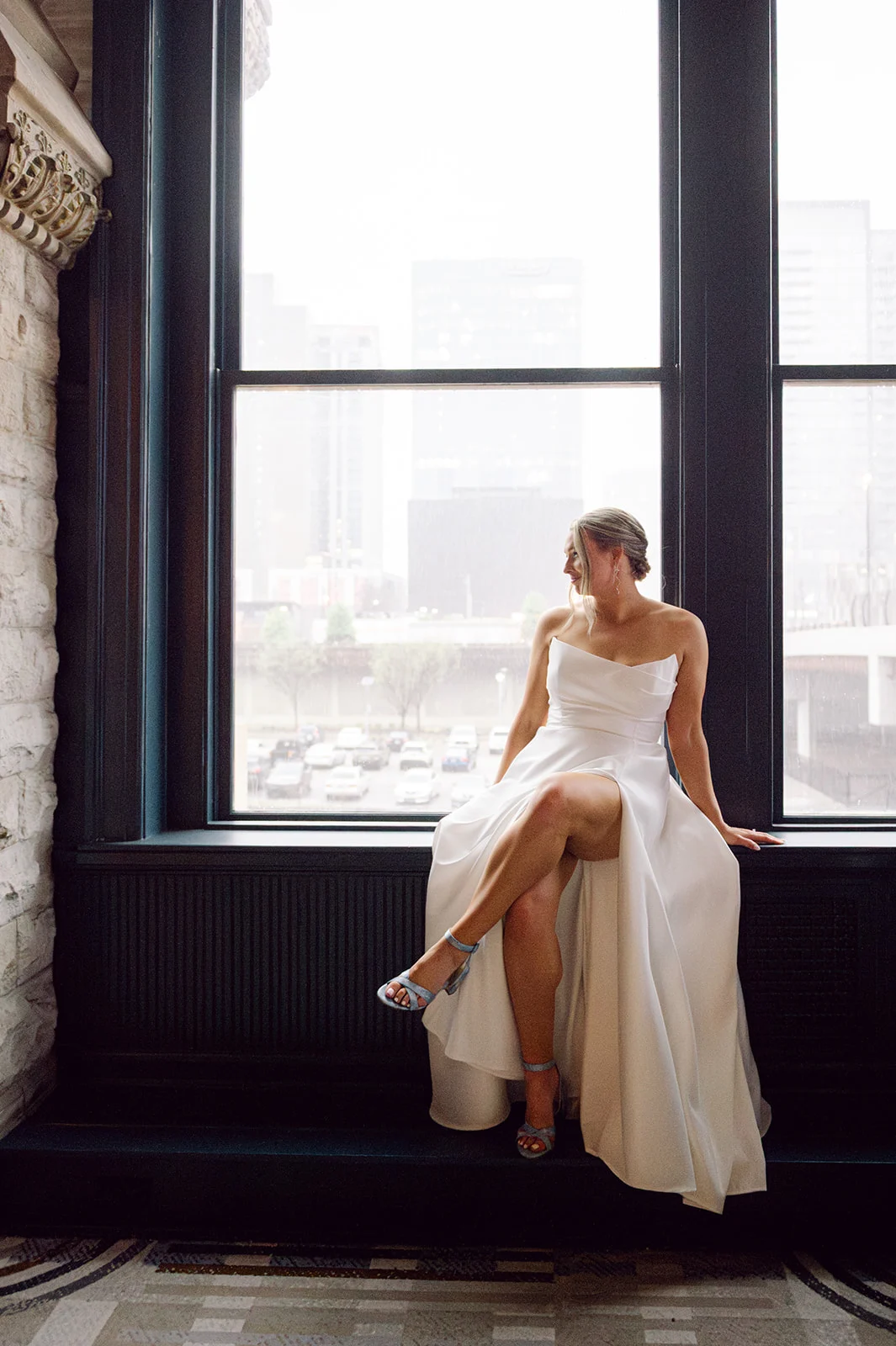 timeless bridal portrait of bride at huge window of Union Station Hotel.