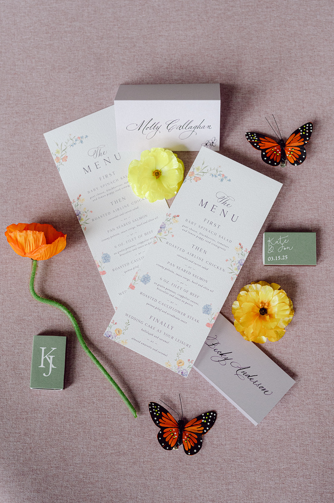 place cards and custom wedding menus with colorful floral accents