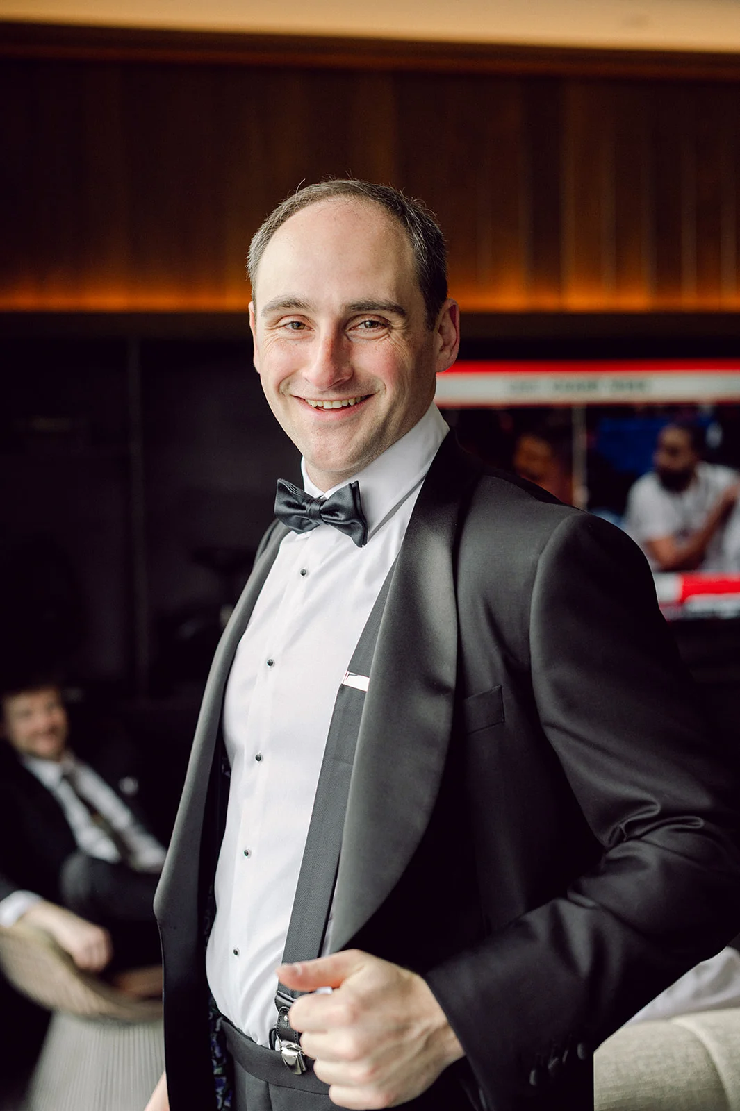 groom in black tux