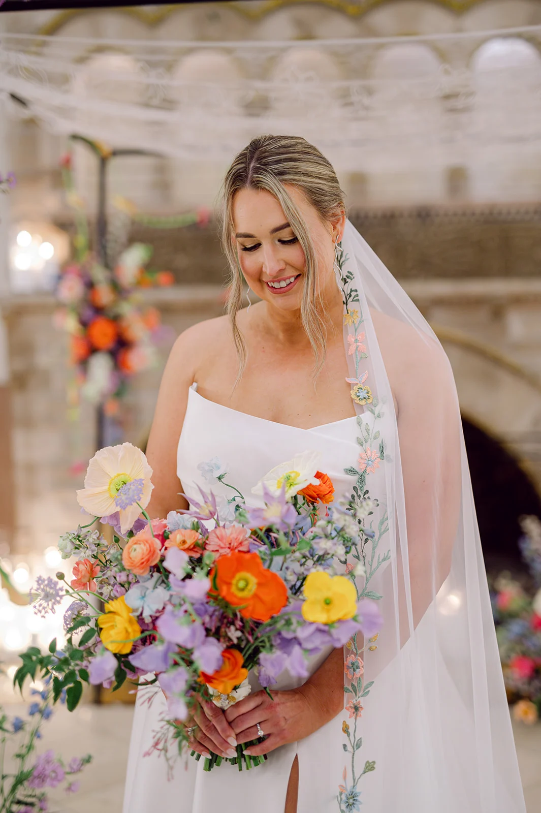 elegant bridal portraits of bride holding colorful bouquet featuring lavender hues.