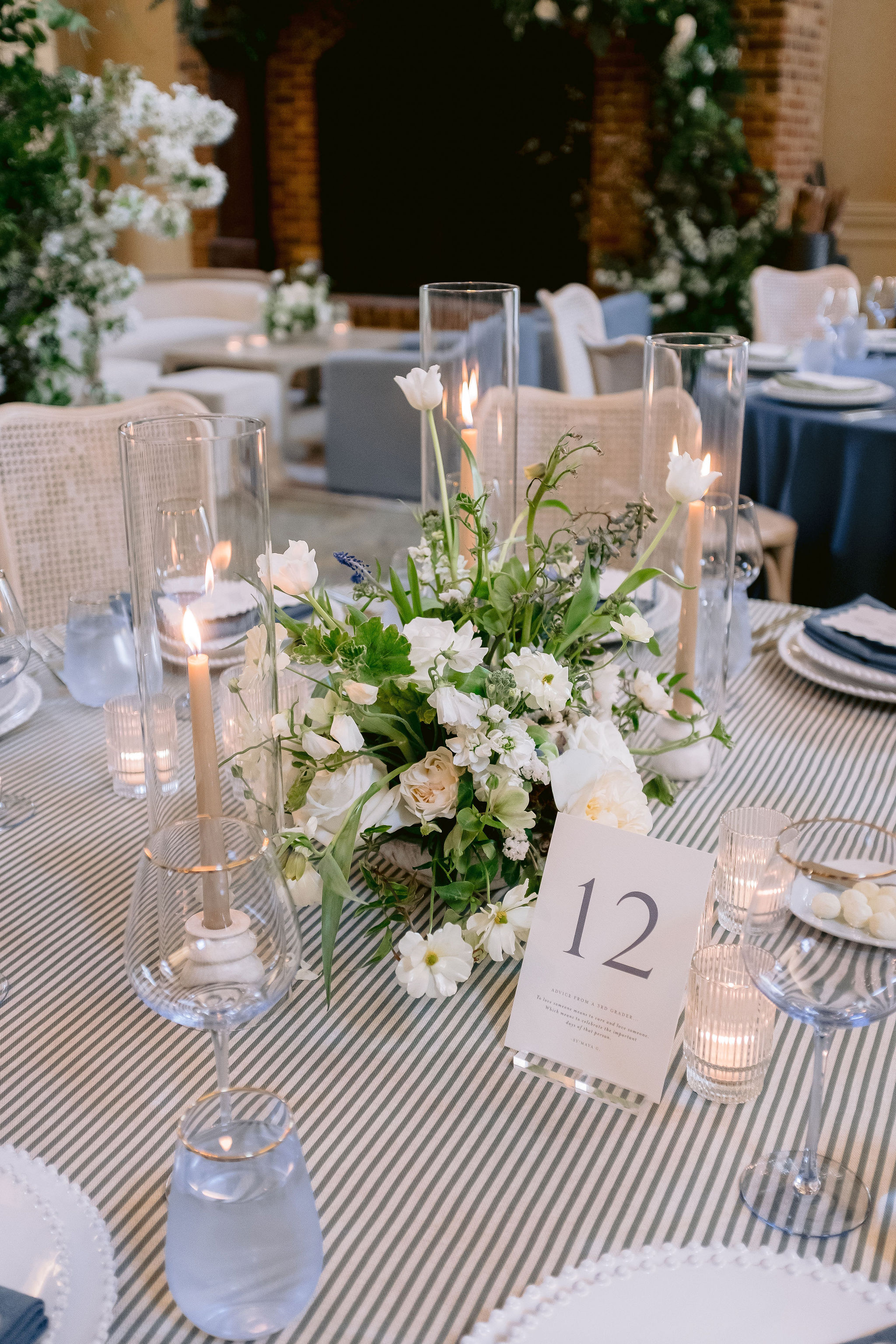  die-cut menu on napkin at place setting with custom table numbers. 
