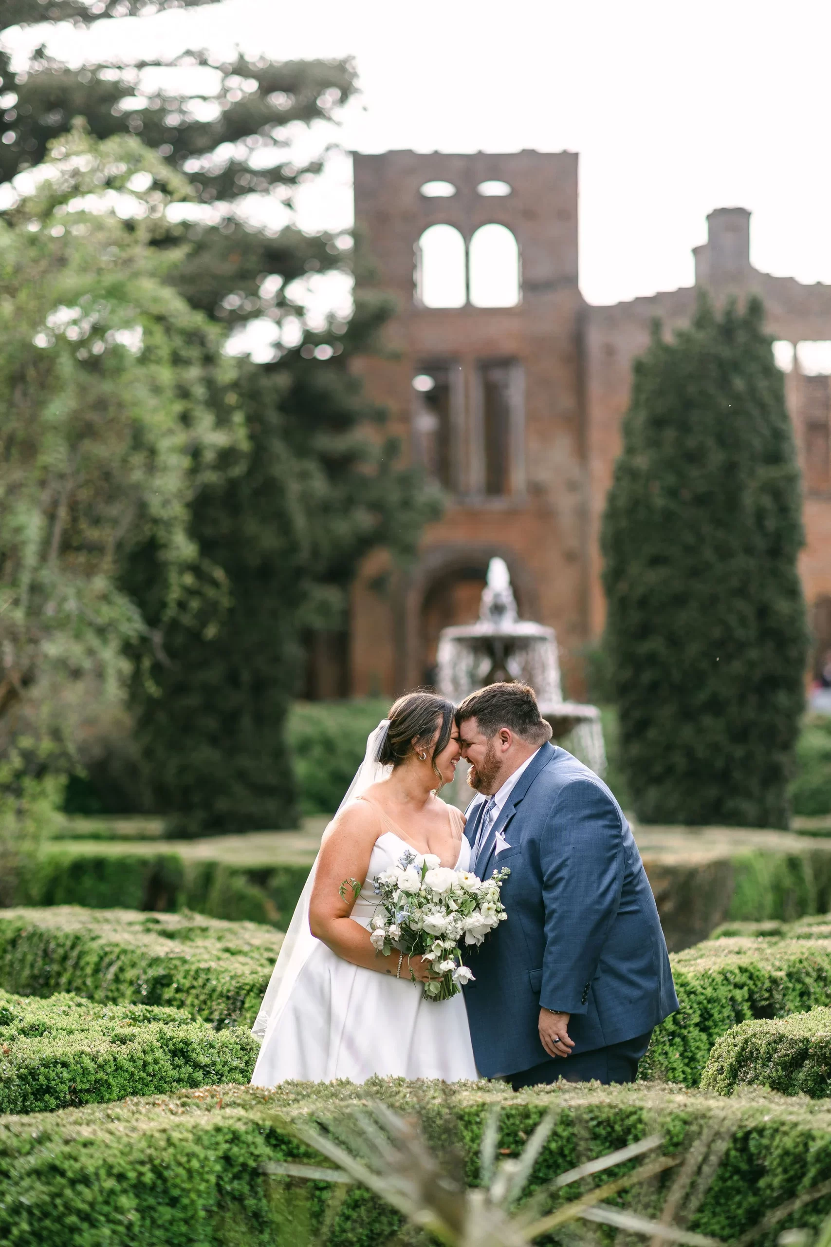 wedding photos of bride and groom in gardens at Barnsley Resort in Georgia