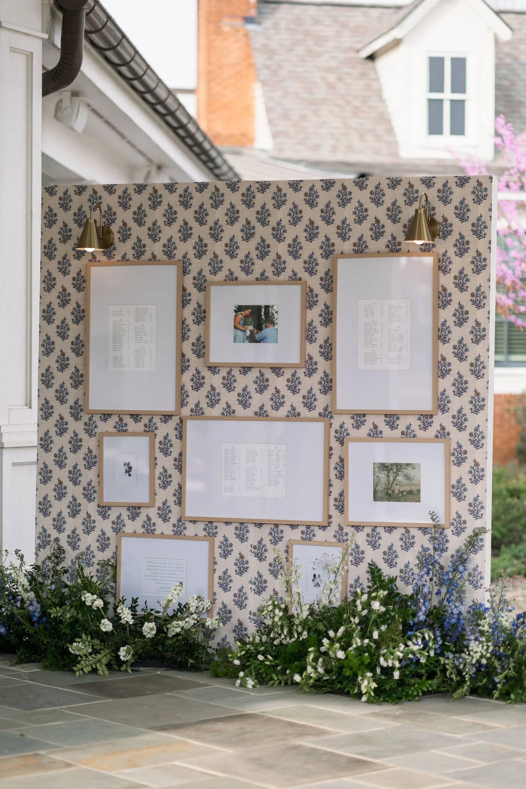 seating chart display with florals surrounding the bottom of display 