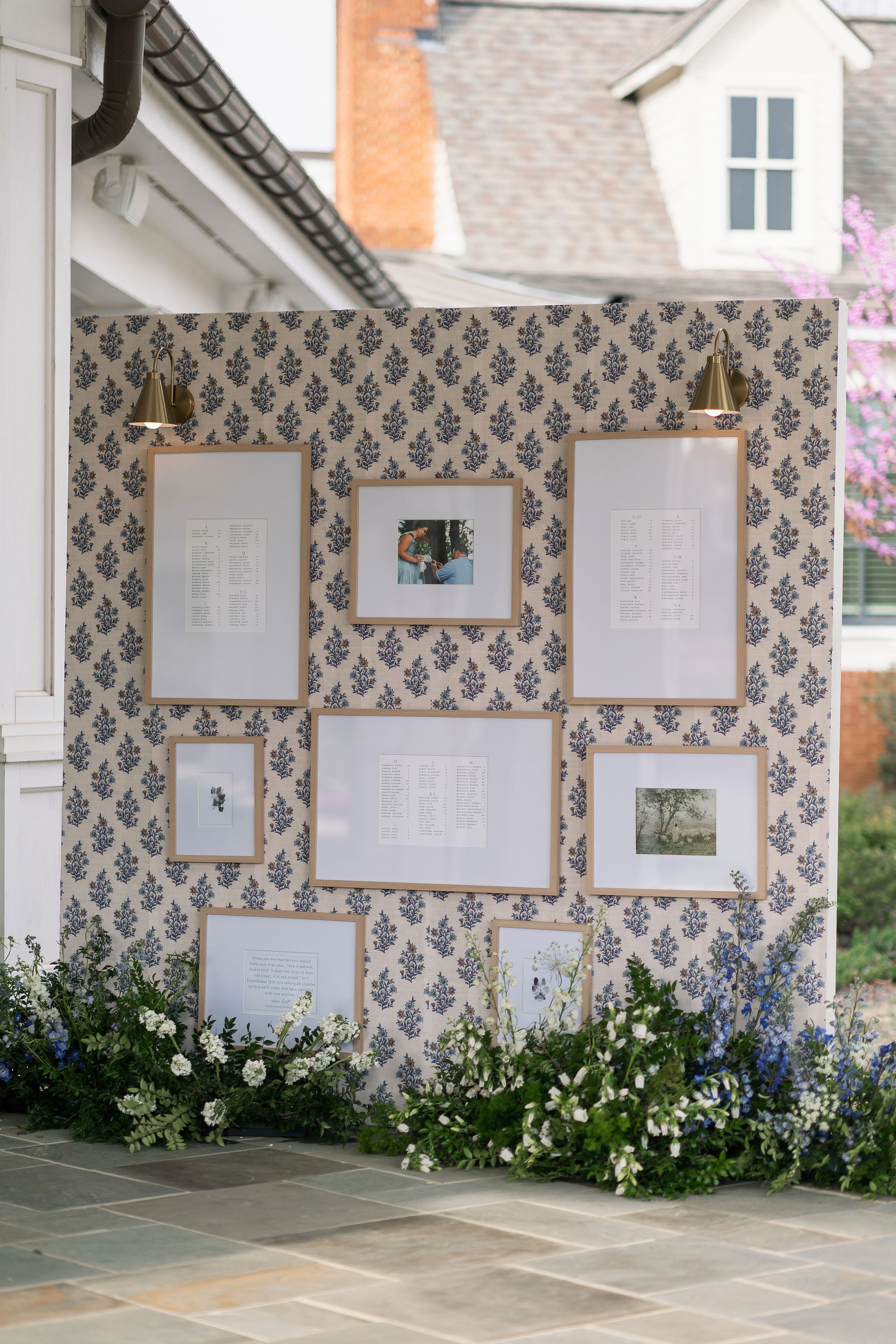 seating chart display with install in wallpaper and surrounded by enchanting florals 

