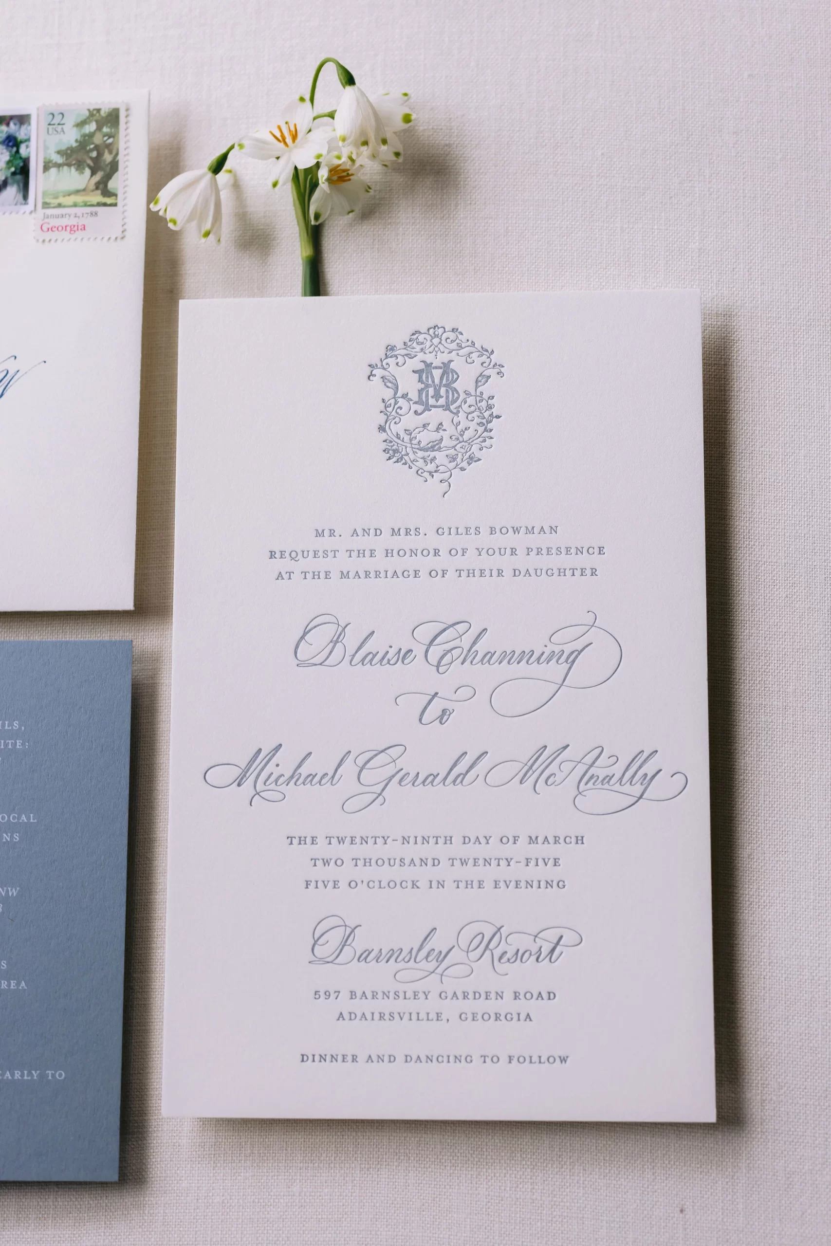 wedding invitation with the same monogram from wedding programs created by Nashville full-service calligraphy studio. 