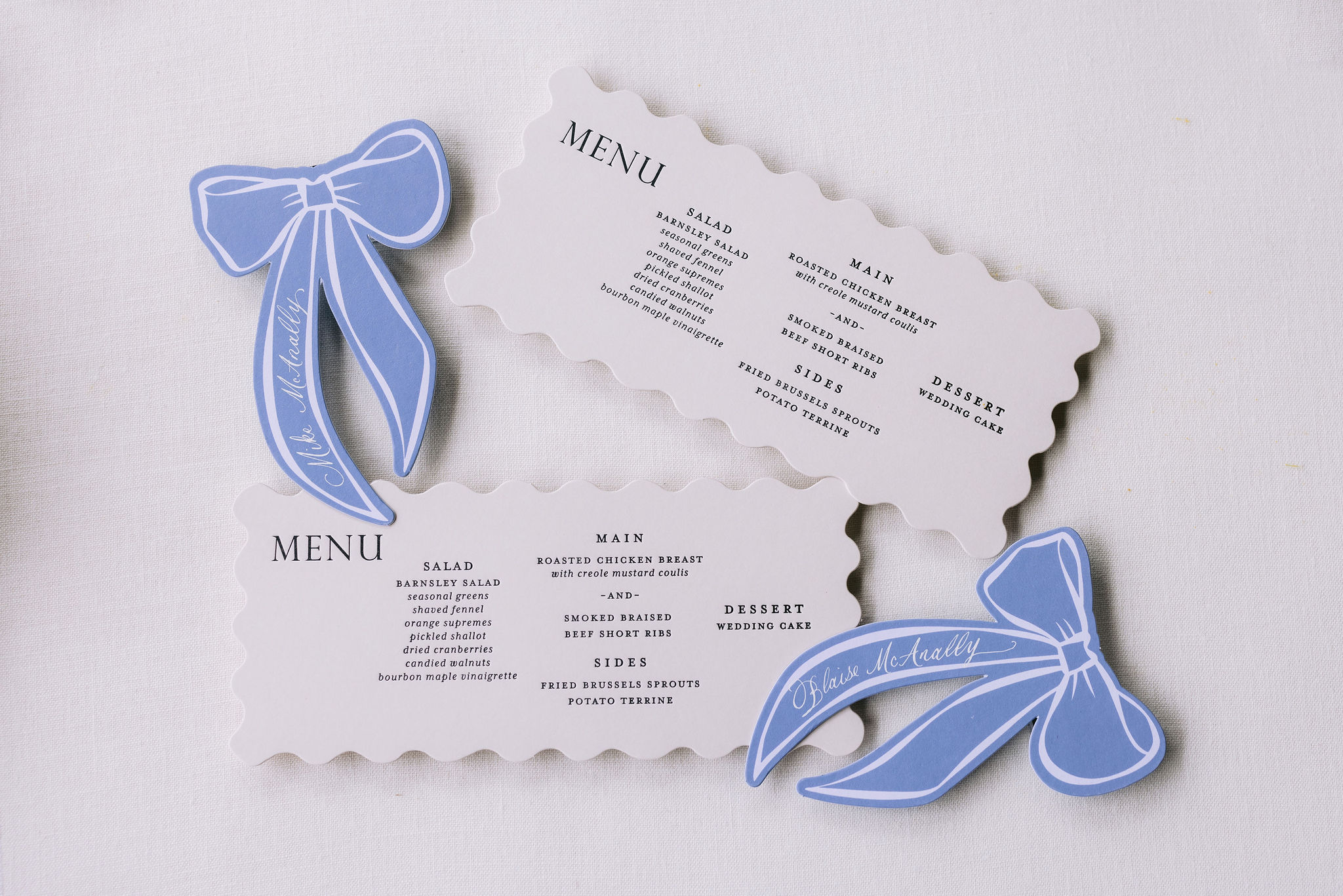 custom die cut menus and blue ribbon place cards from romantic Barnsley Resort Wedding. 
