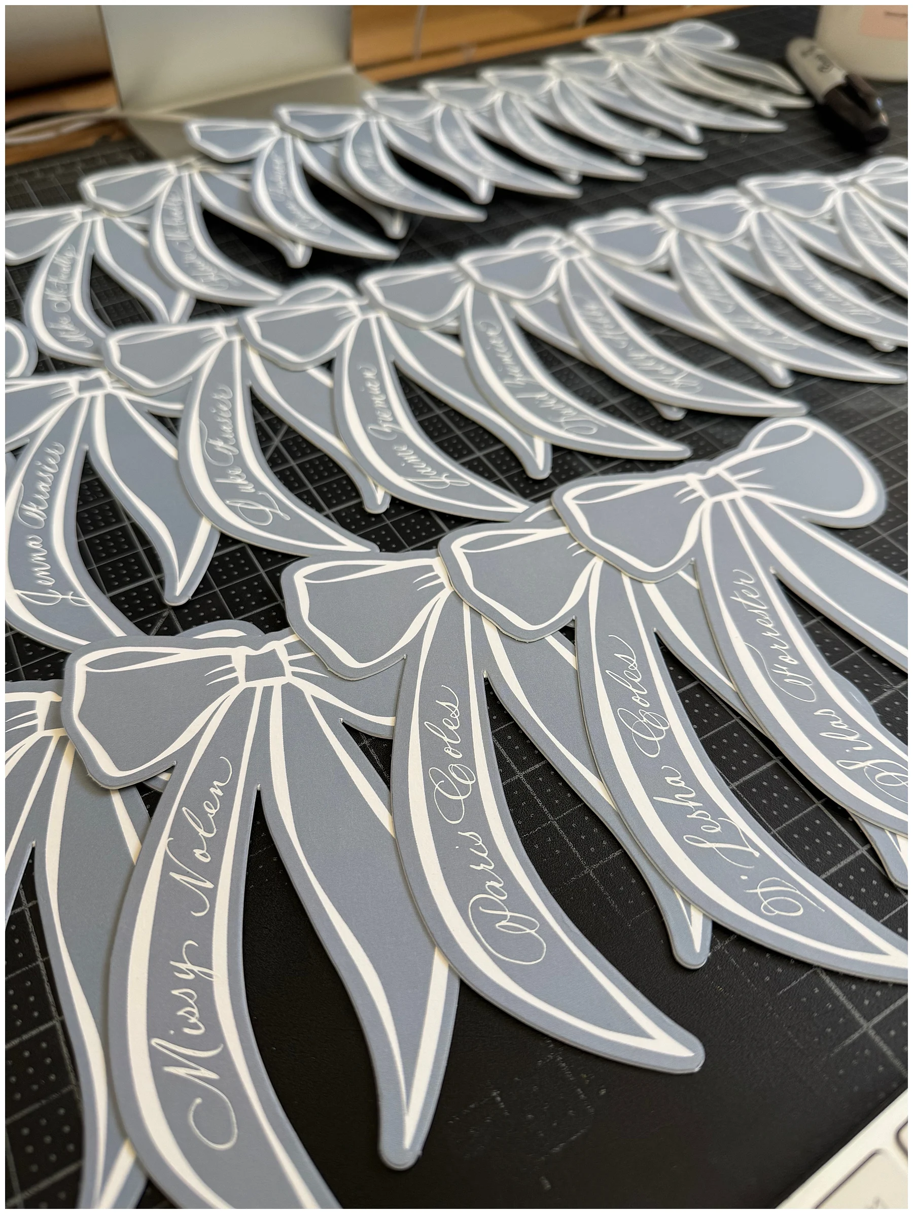 Unique and custom ribbon place cards with calligraphy.