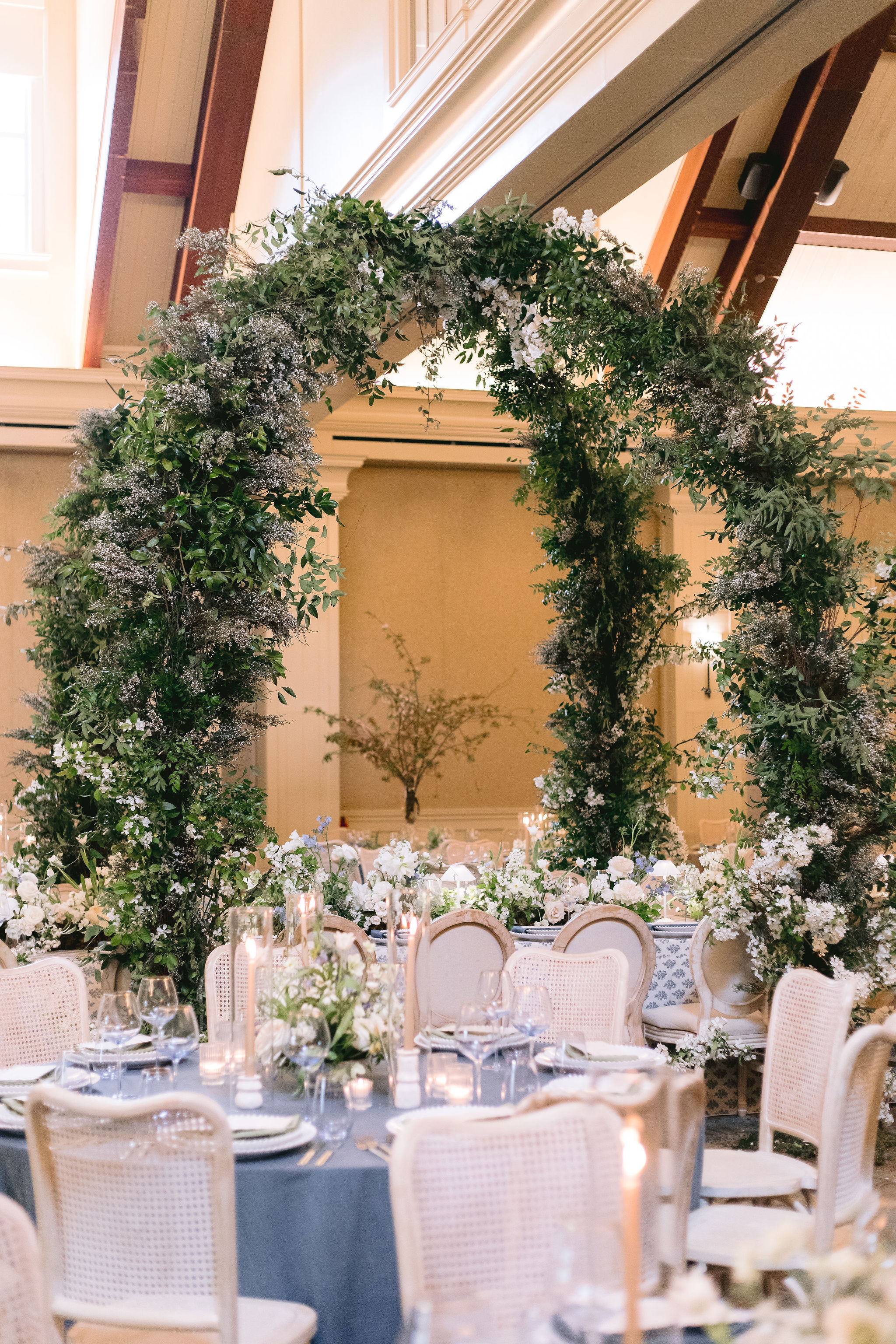 enchanting floral arches surround elevated tablescape from Georgia wedding at Barnsley Resort.  
