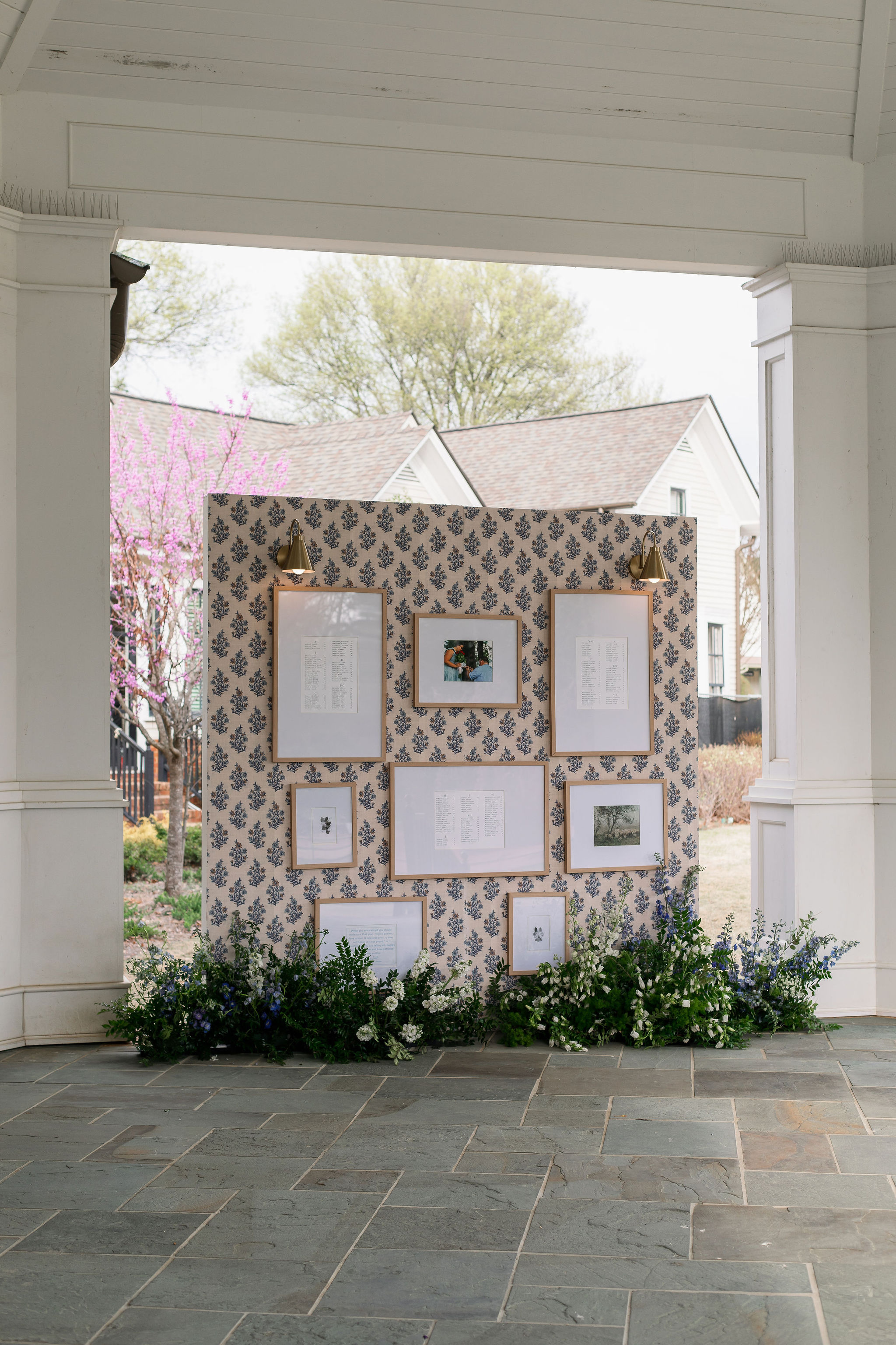 seating chart display with install in wallpaper and surrounded by enchanting florals 