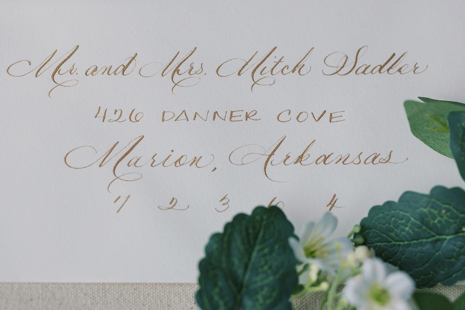 calligraphed envelopes in gold 