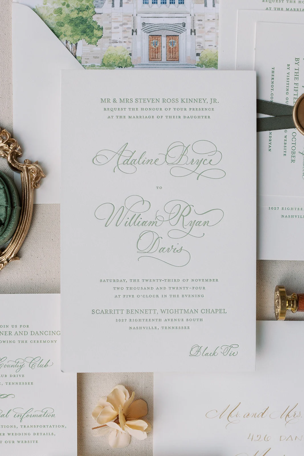 watercolor envelope liner of wedding venue on green wedding invitation suite