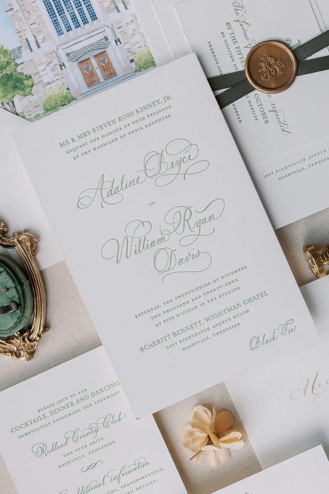 watercolor envelope liner of wedding venue on green wedding invitation suite
