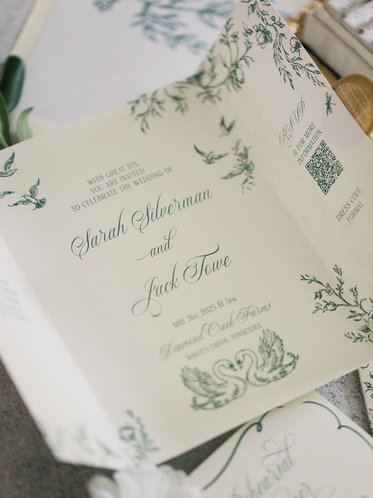 swan design and vines in dark green cover gatefold wedding inviation