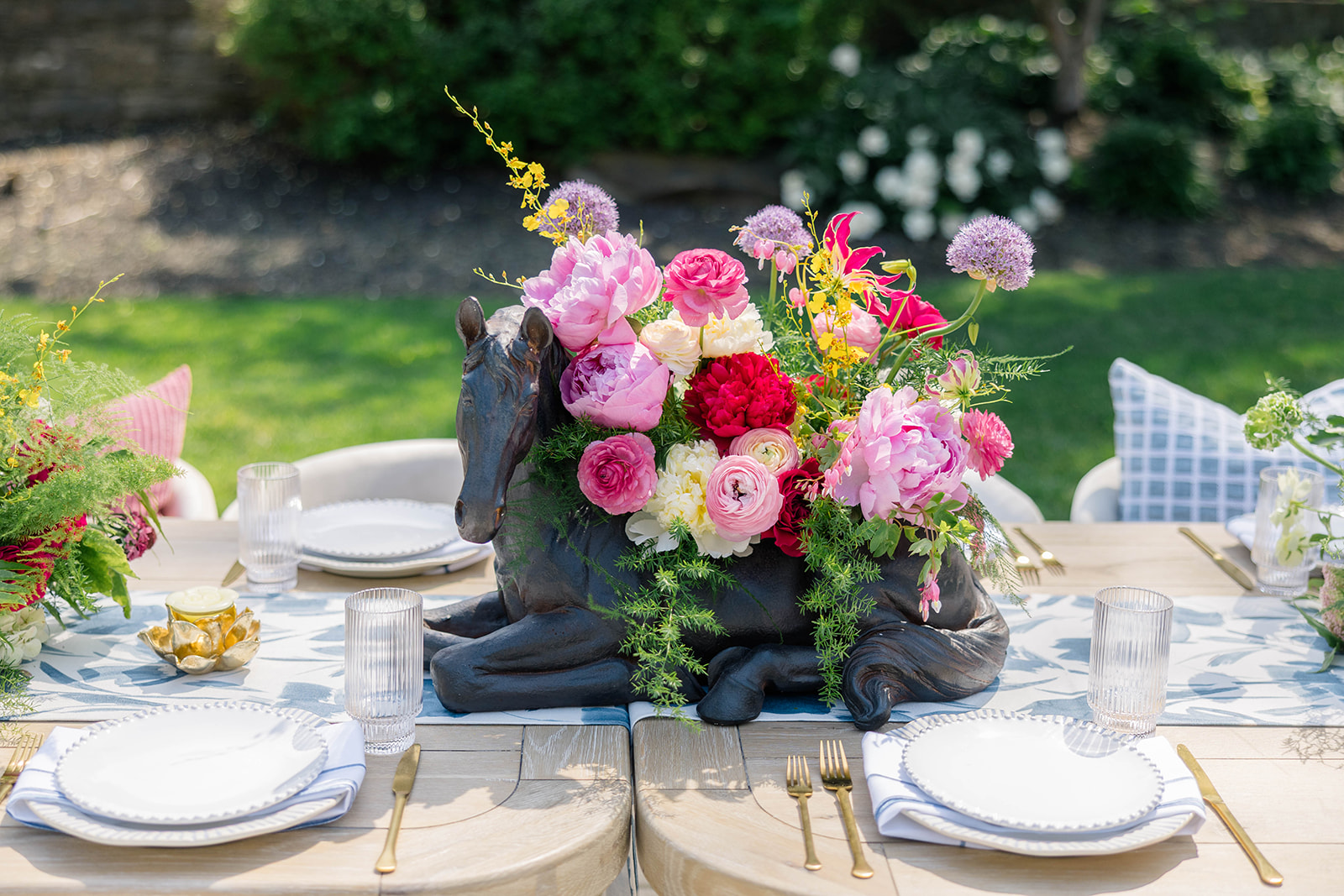 Kentucky Derby Inspired Event with horse vases as centerpieces 