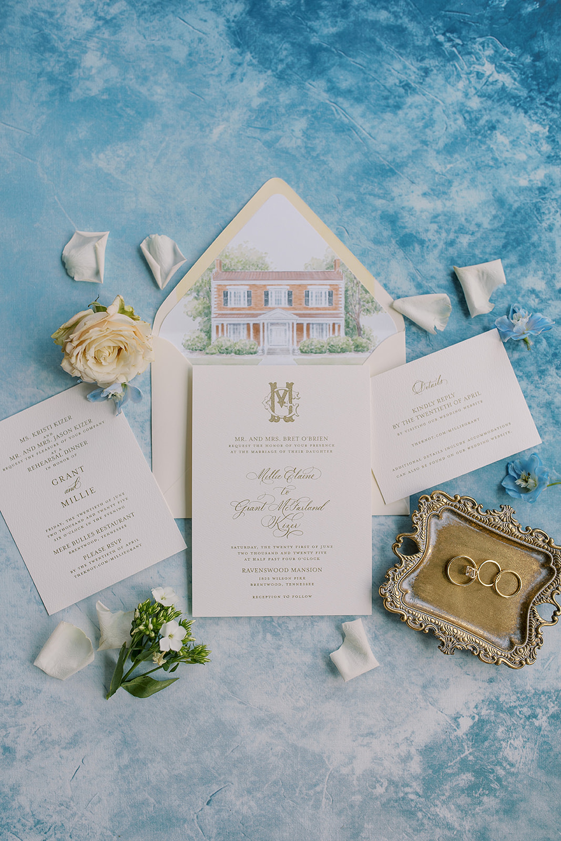elegant invitation suite featuring gold details and custom venue sketch on envelope liner