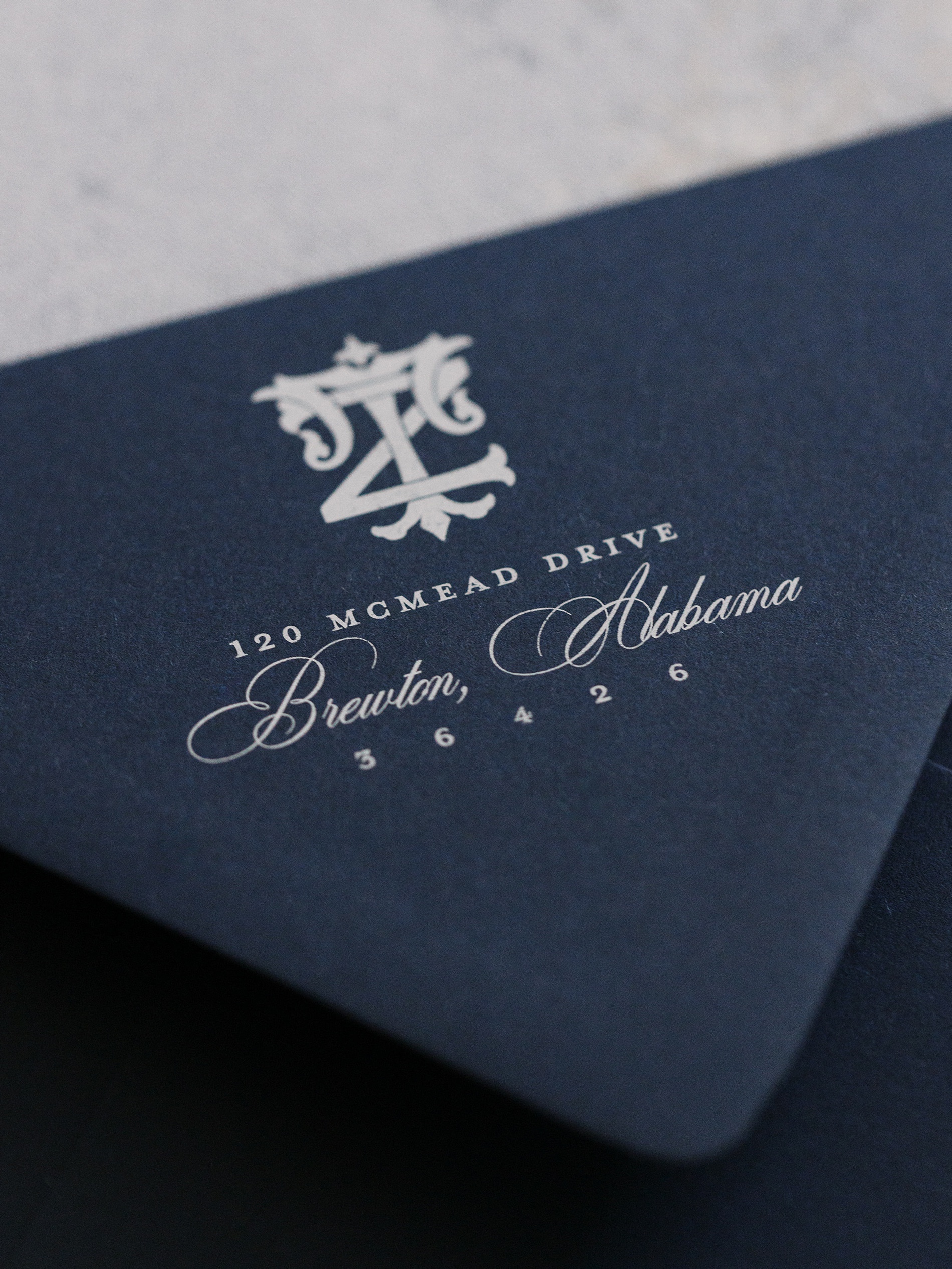 custom monogram on dark blue envelope 