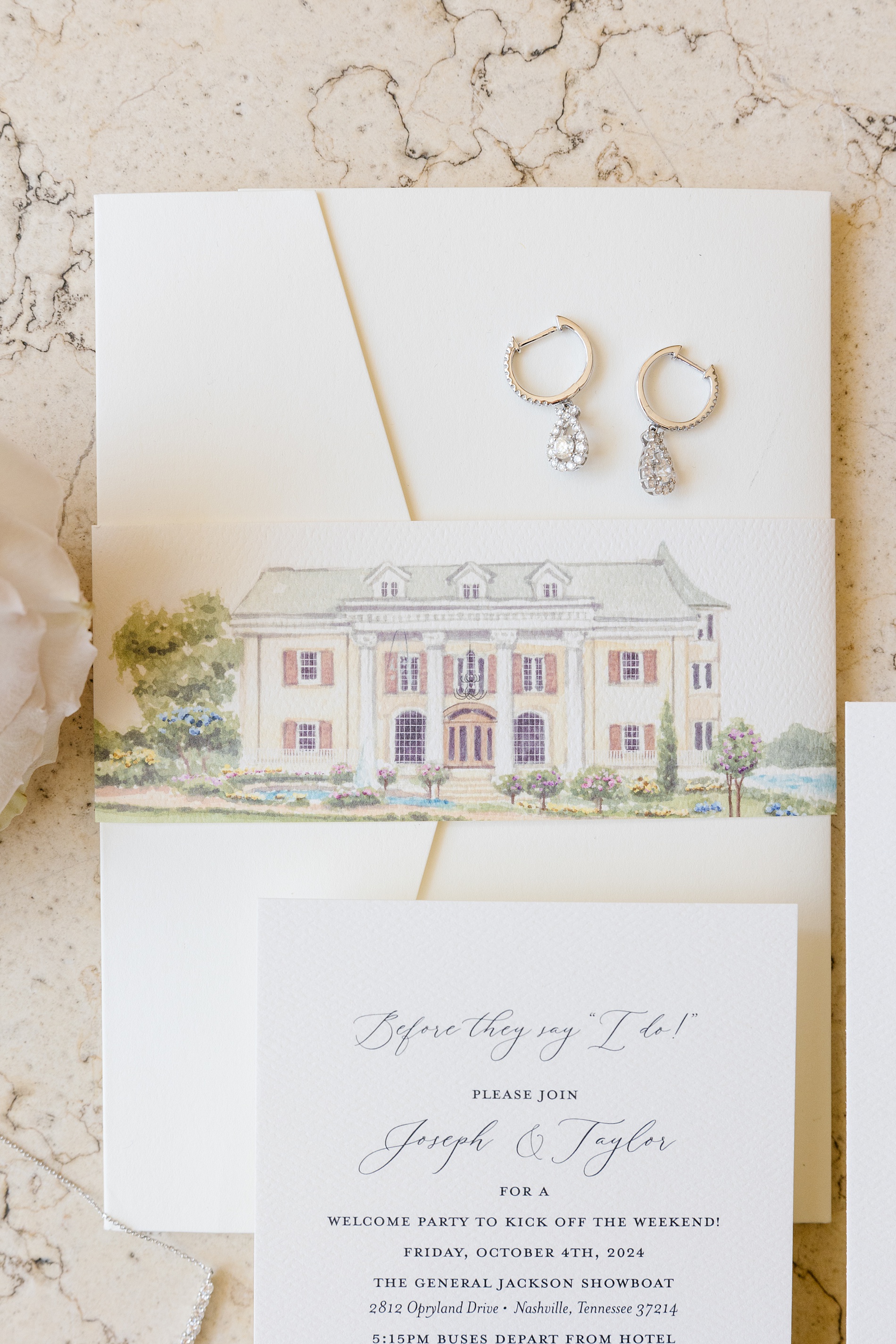 watercolor design of Nashville wedding venue on invitation suite wrap from Luxurious Fall Wedding at Cherokee Dock