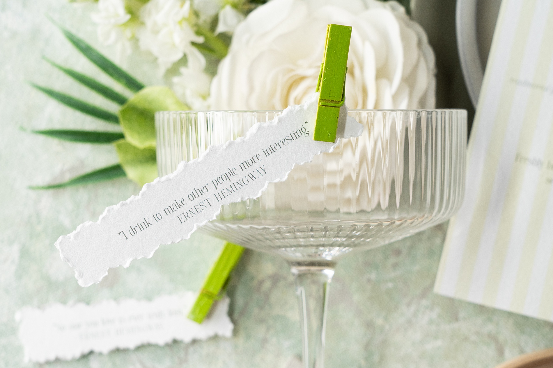 Ernest Hemingway quote clipped on cocktail glass at Key West wedding