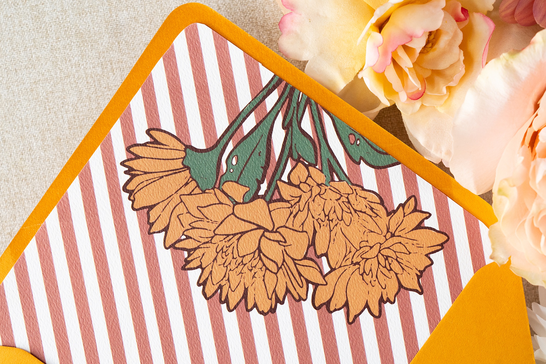 custom envelope liner of pink stripes and marigold flower design | Wedding Invitations That Pop