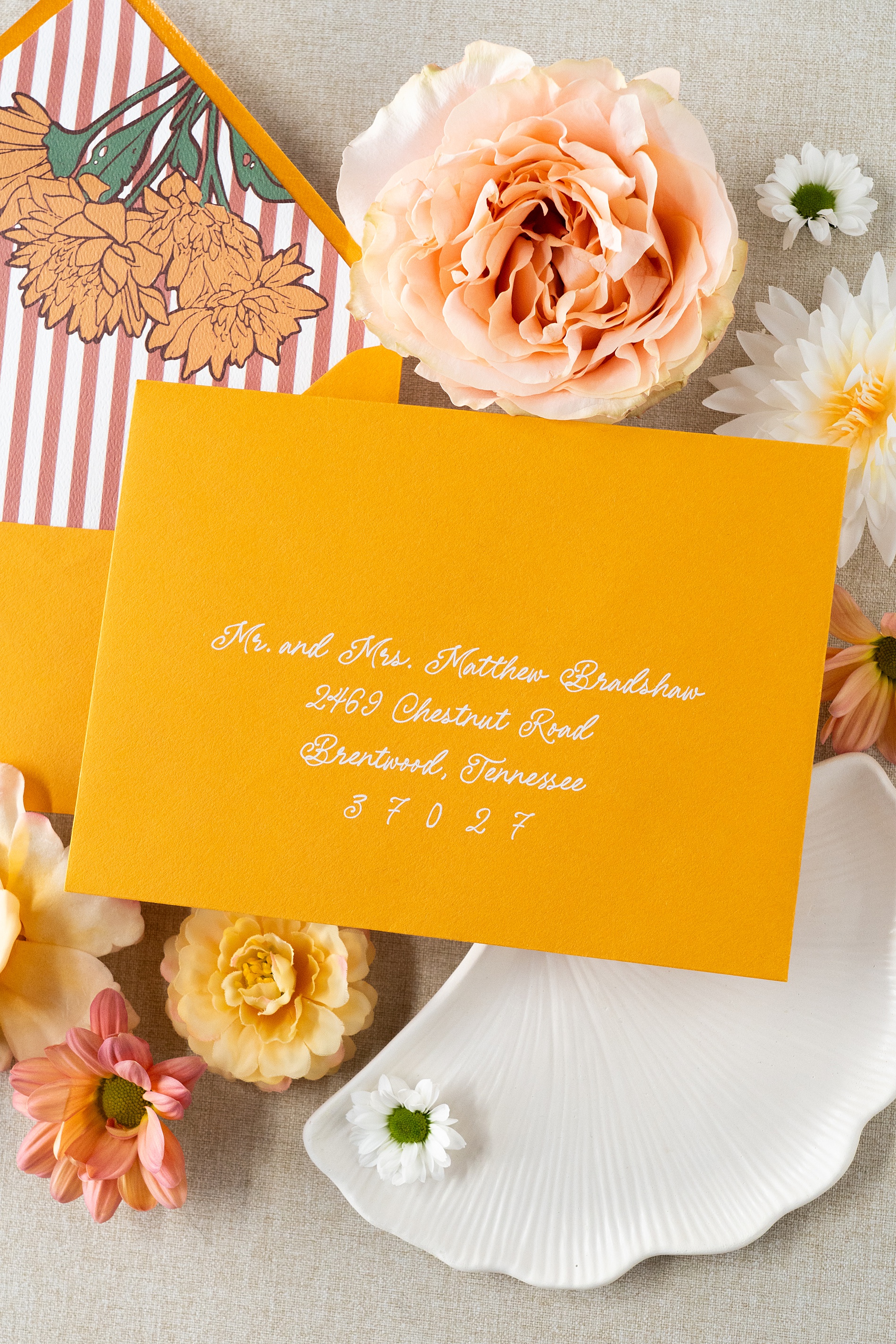 yellow envelope with white calligraphy 