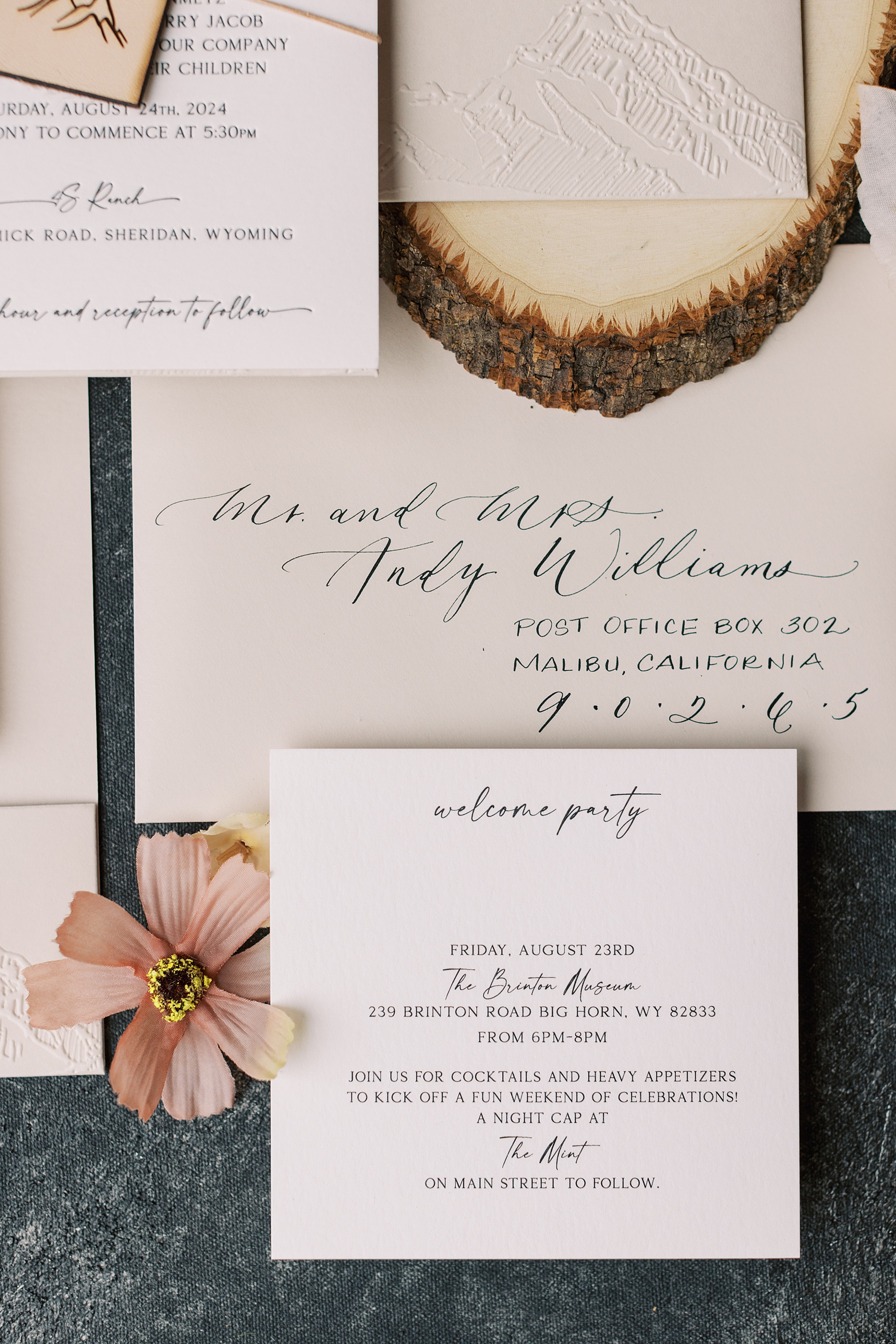 embossed mountain design, custom calligraphy and leather tag with mountain design from Western-Inspired Wyoming Ranch Wedding in Sheridan, WY