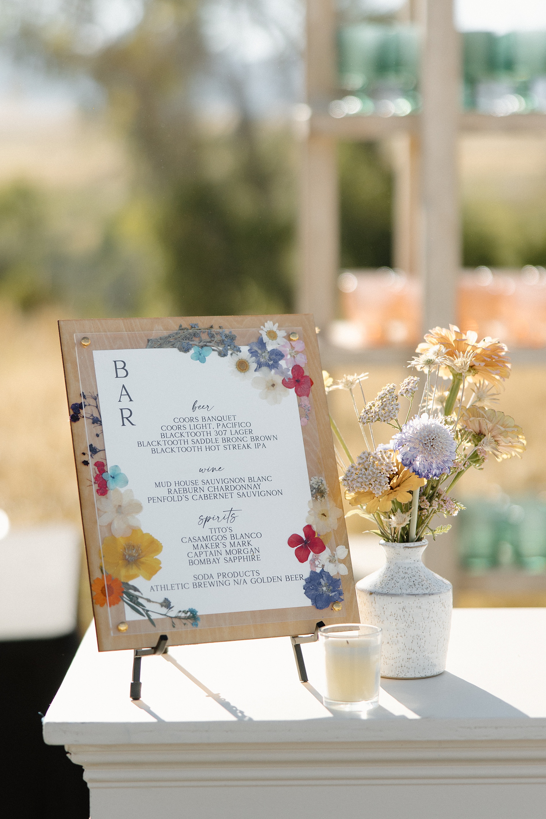 pressed flowers on custom bar sign 