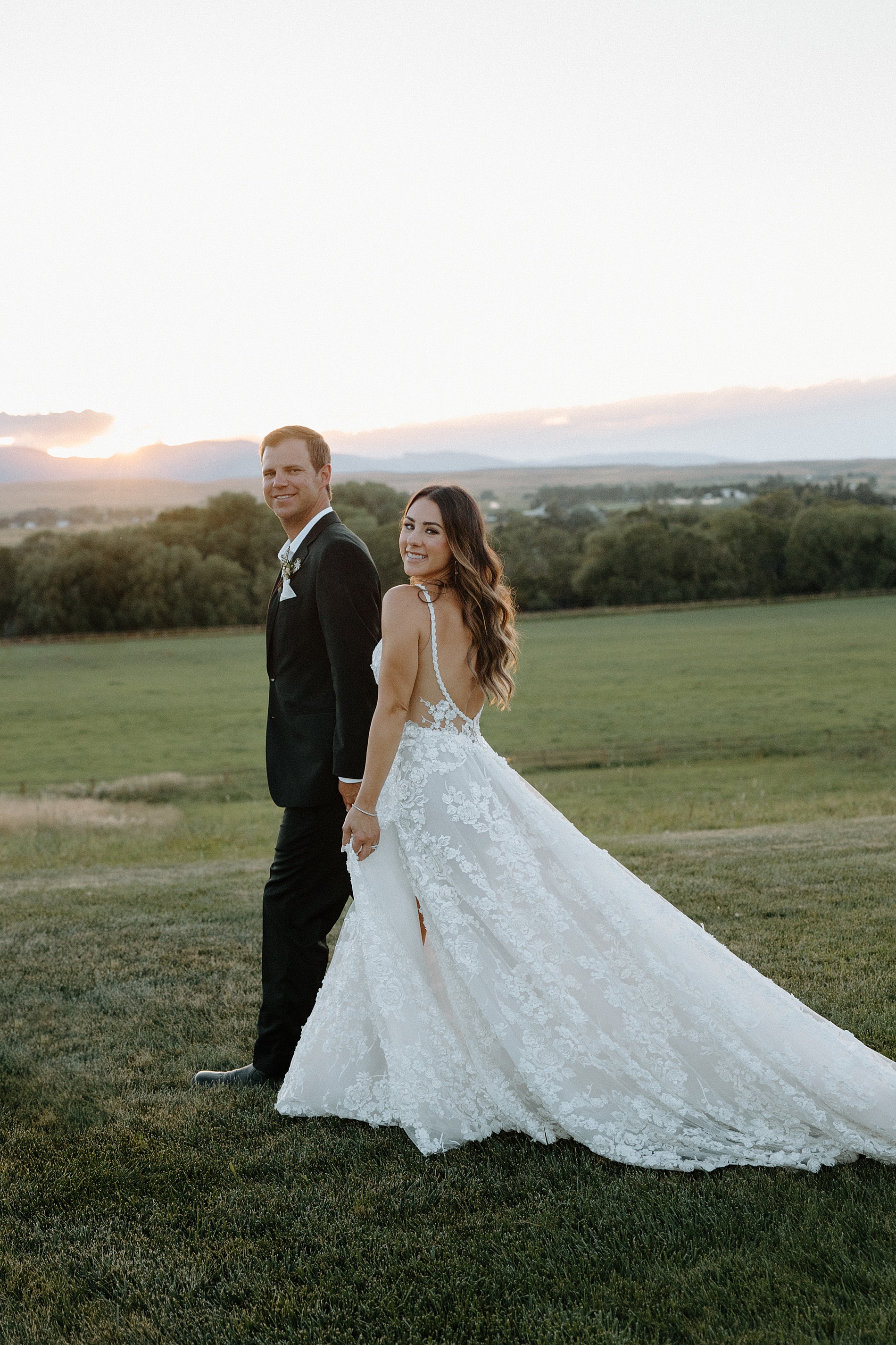 newlywed photos with the mountains in the distance 