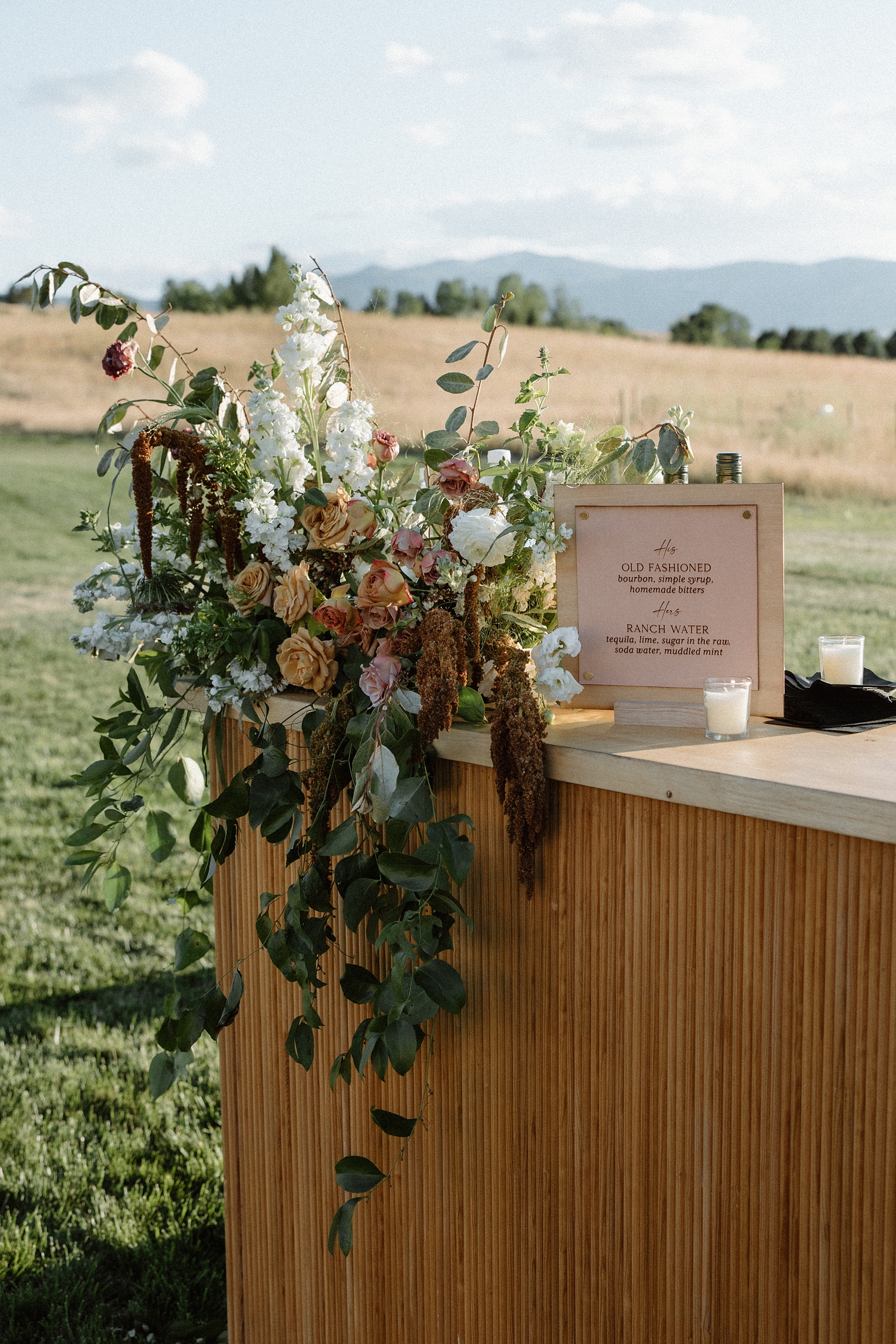 wood and leather bar sign with western aesthetic 